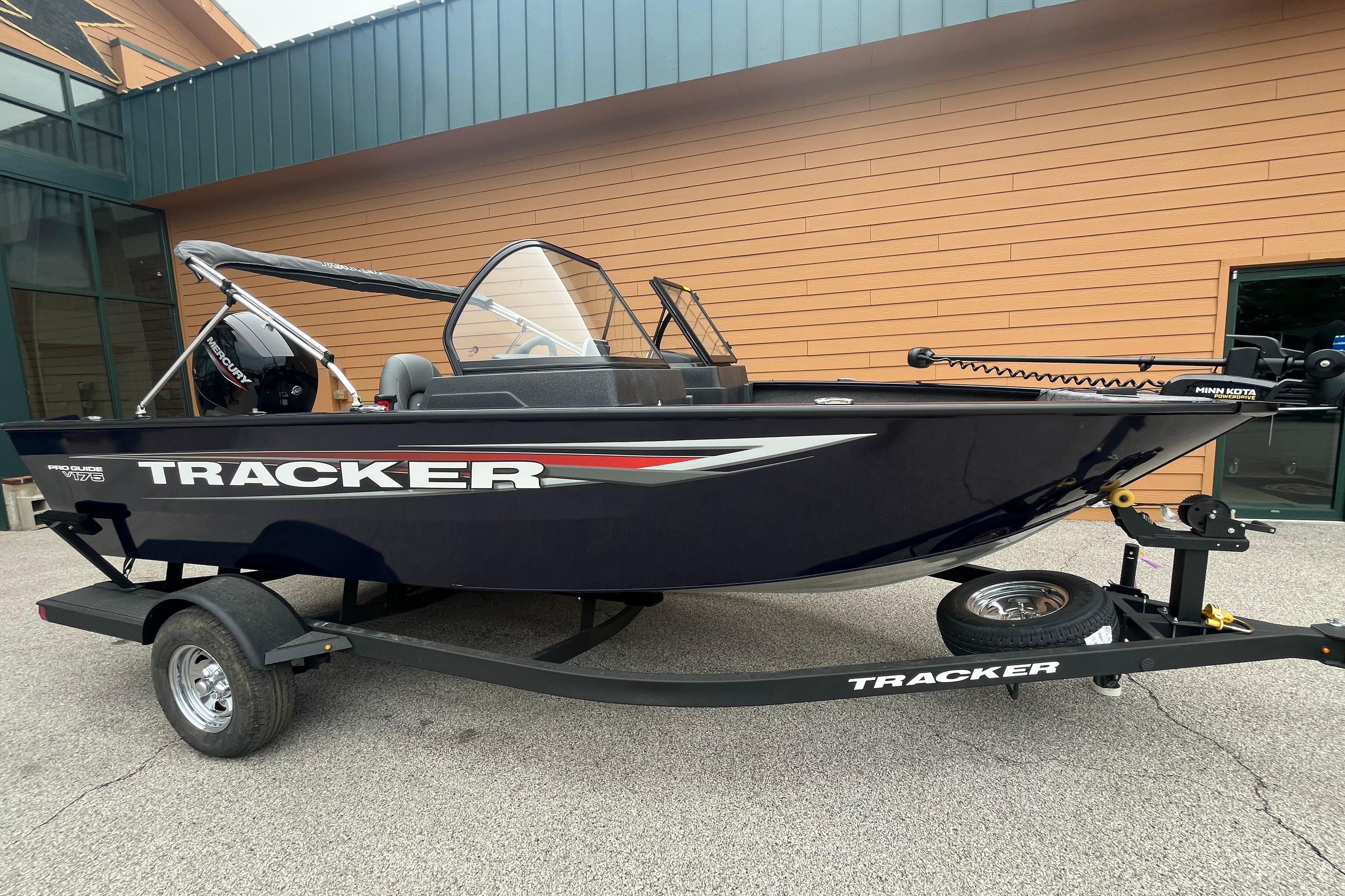 2026 Tracker Pro Guide V-175 WT boat on trailer, parked outdoors.