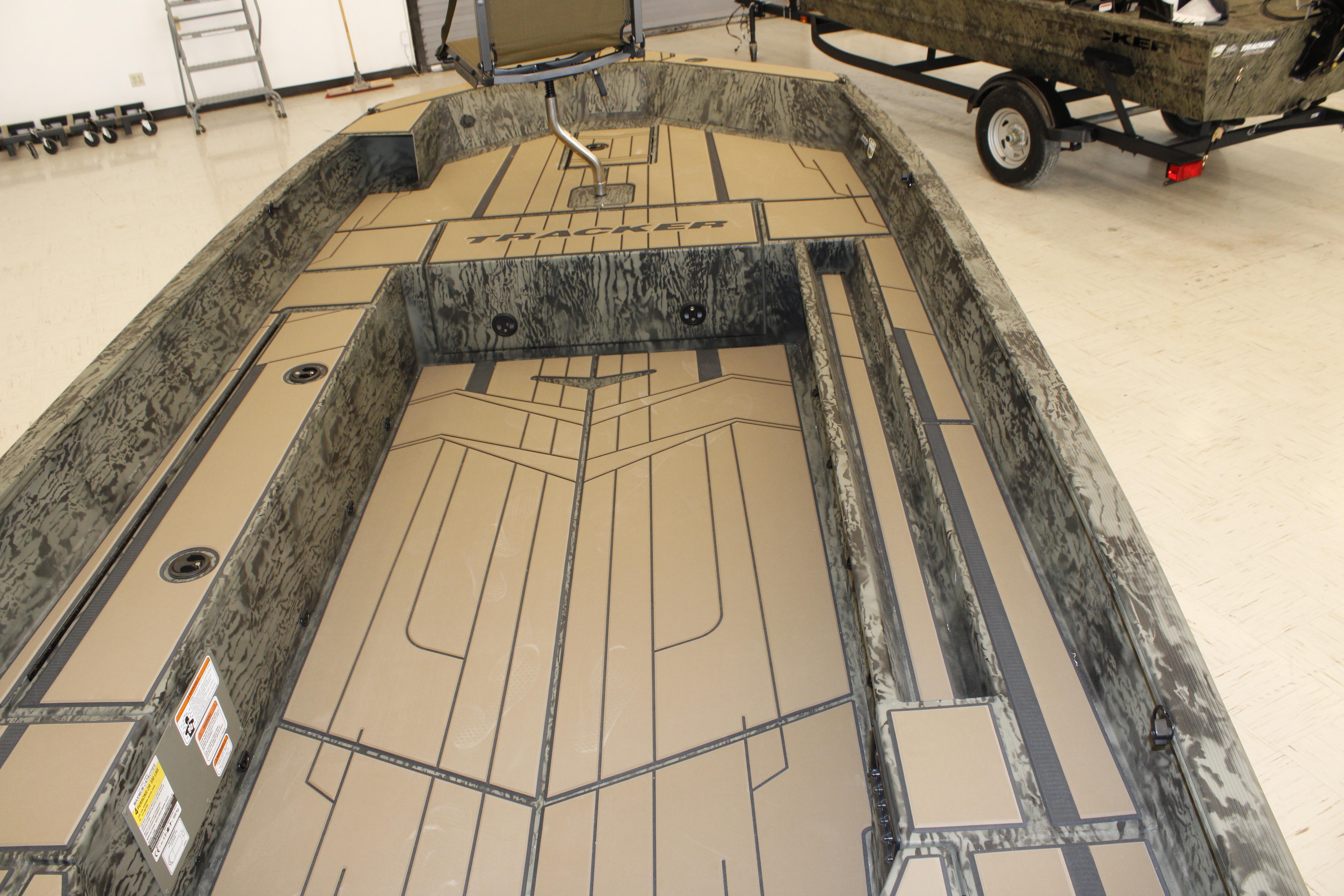2026 Tracker Grizzly 1756 T Marsh boat interior with camouflage design and spacious layout.