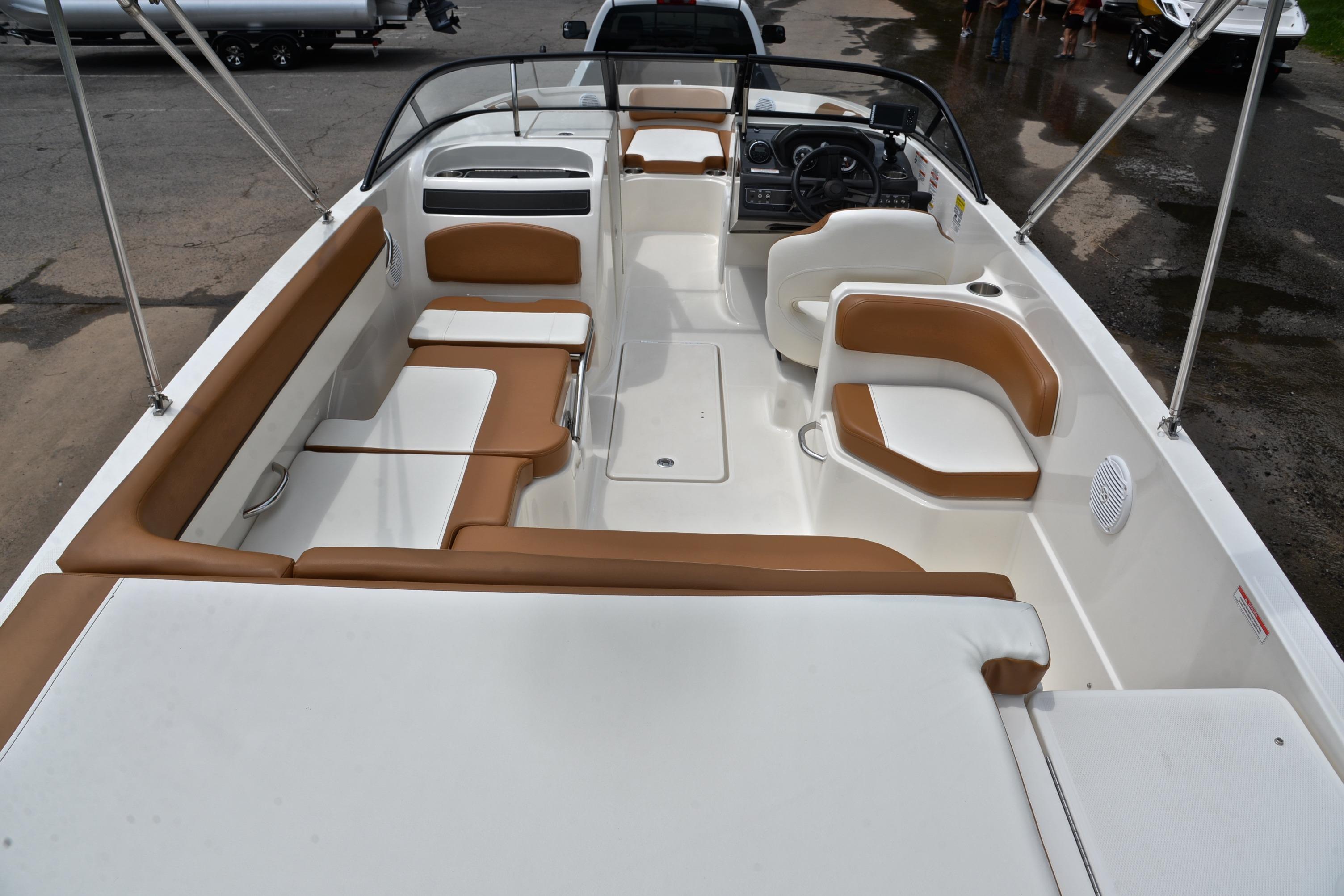 2019 Bayliner VR6 Bowrider OB interior with tan and white seating, spacious layout.