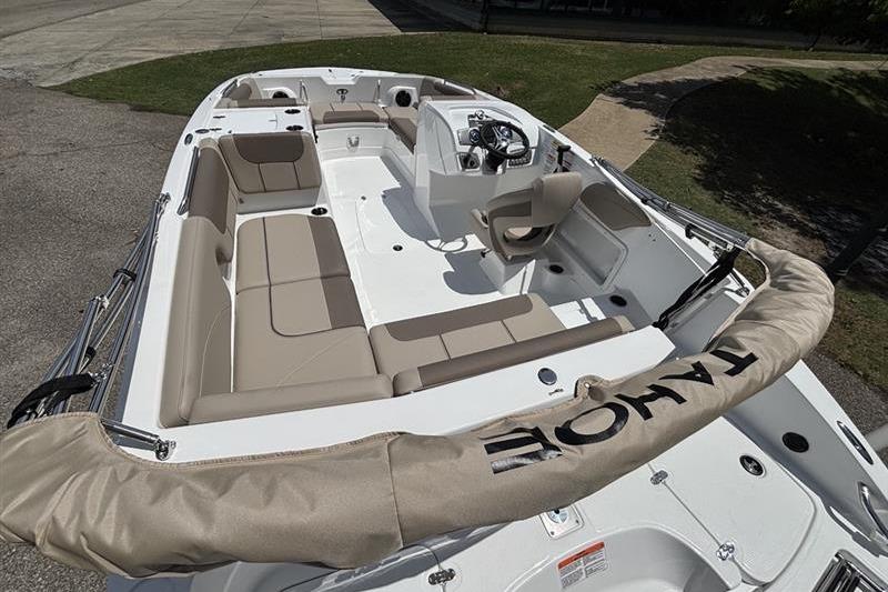 2026 Tahoe 2150 boat interior with beige seating and steering console.