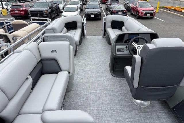 2026 Sun Tracker SportFish 22 DLX pontoon boat interior with plush seating and modern dashboard.