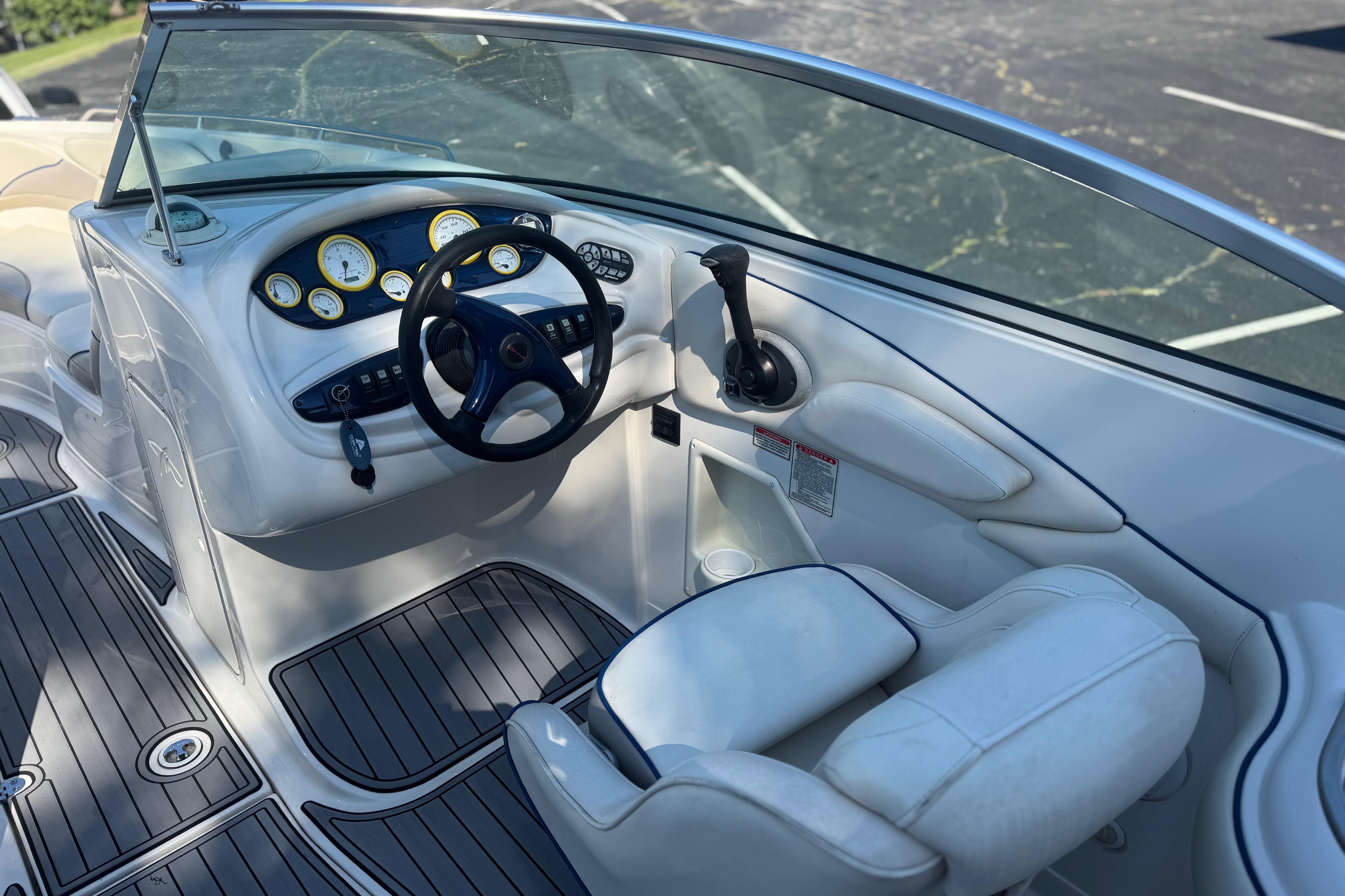Cockpit of a Monterey 268SS Super Sport boat with steering wheel and gauges.