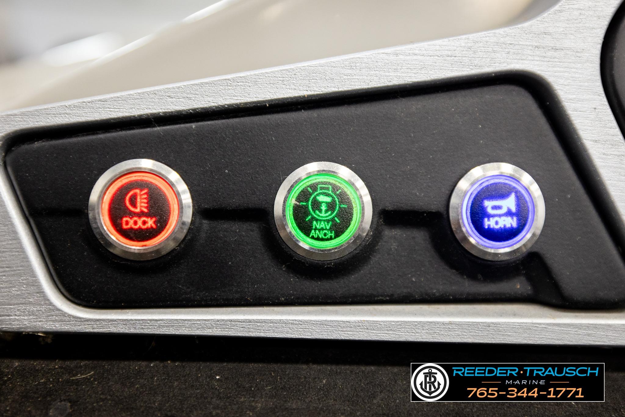 Control panel of a 2019 Manitou Oasis SR VP boat with dock, navigation, and horn buttons.