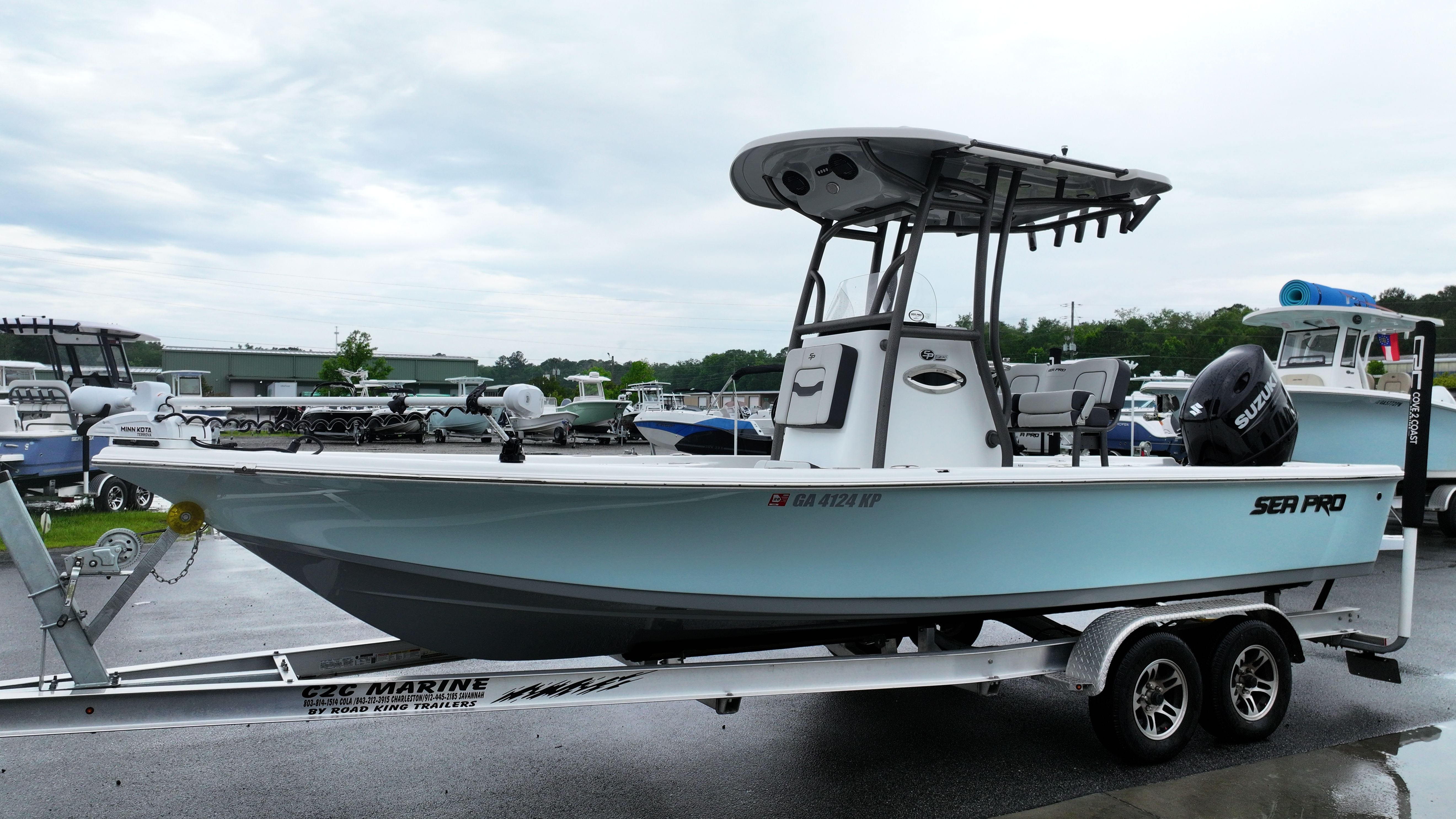 A 2025 Sea Pro 230 DLX boat on a trailer, ready for the water.