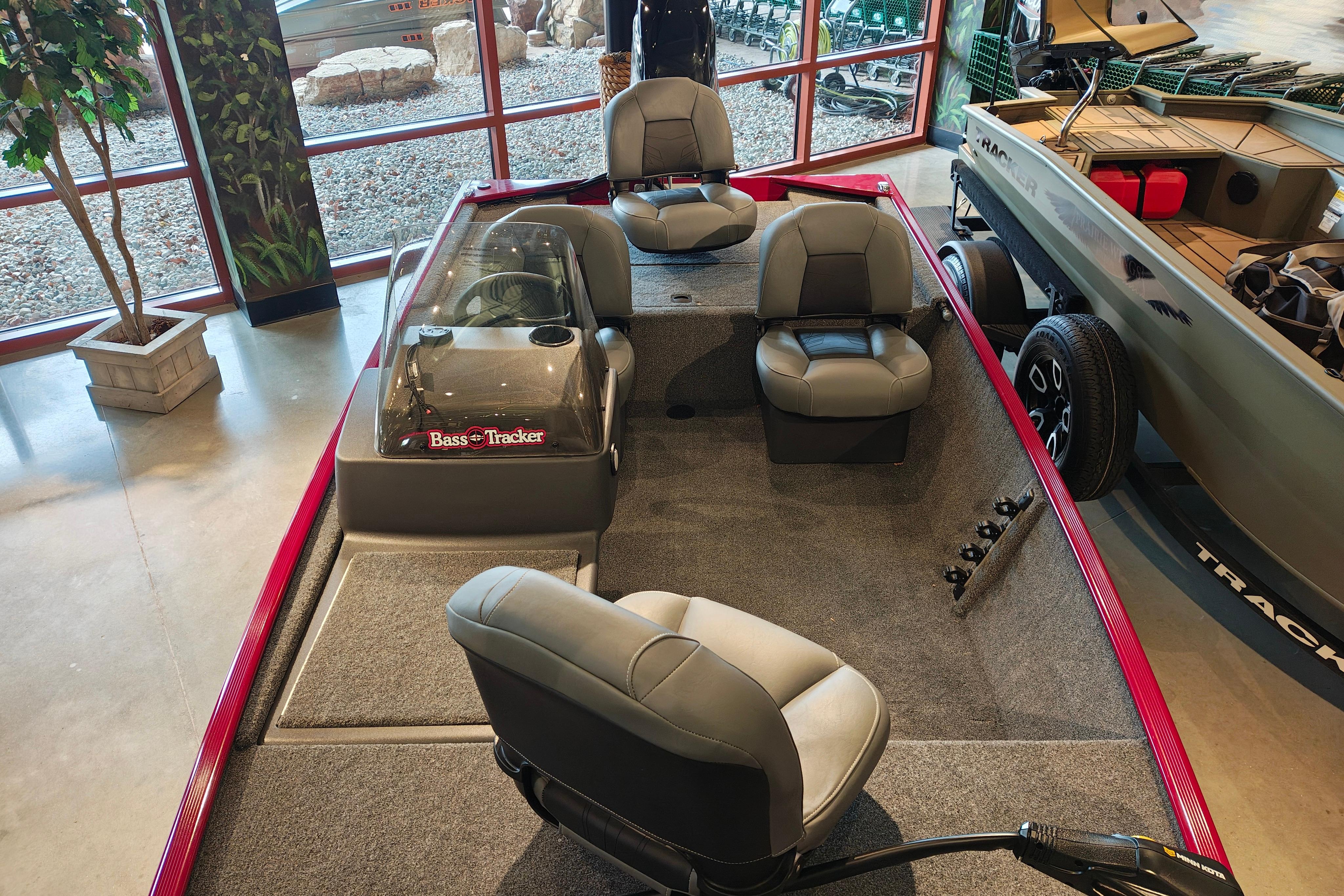 2026 Tracker Bass Tracker Classic XL boat interior with seating and steering console.