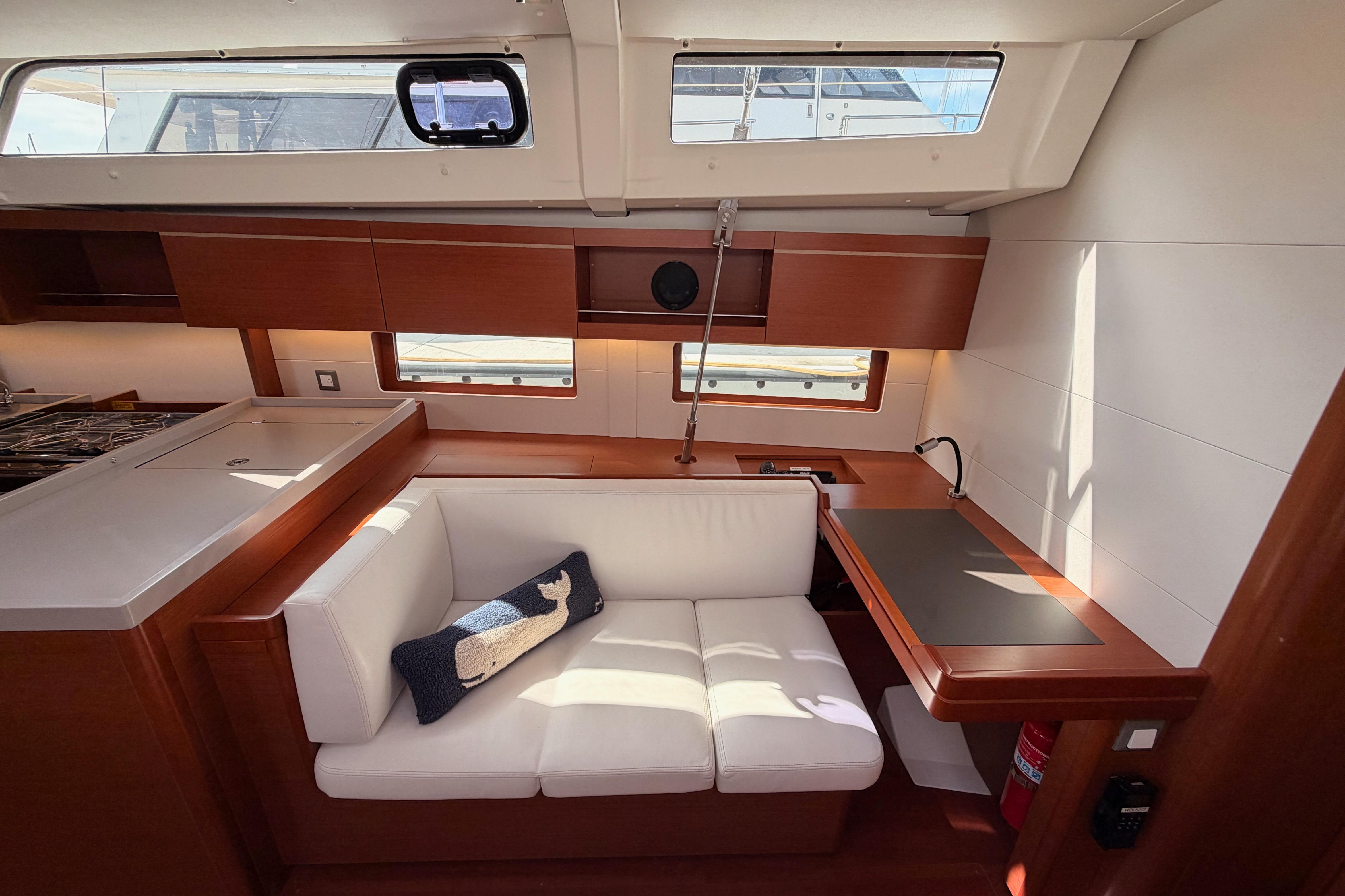 Interior of 2020 Beneteau Oceanis 46.1 yacht with modern seating and wooden finishes.