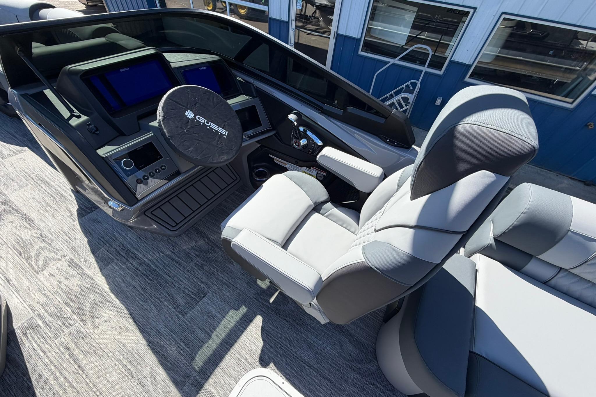 2026 Avalon Excalibur LTD Quad Lounge boat interior with modern dashboard and comfortable seating.