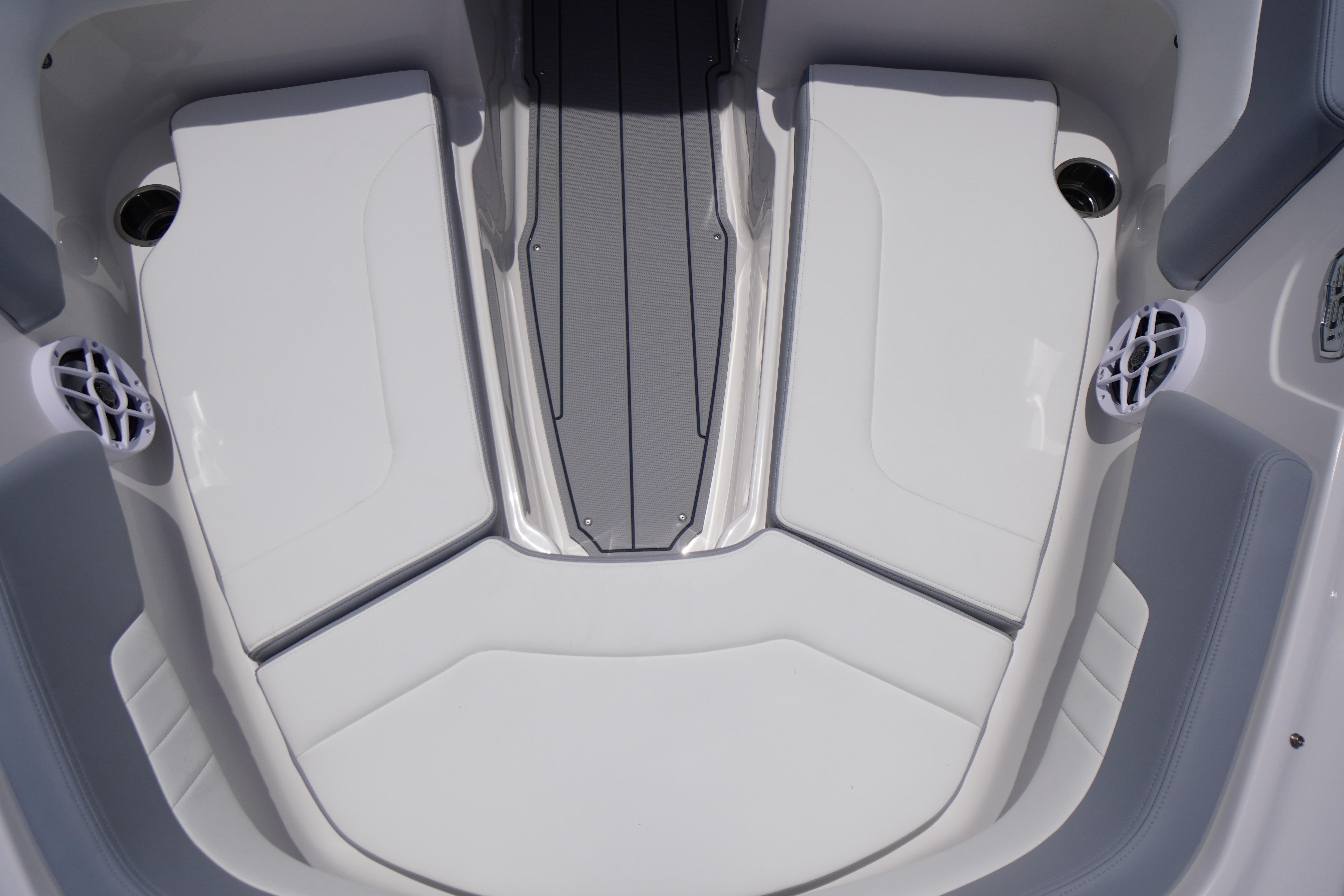 2026 Chaparral 23 SSi OB boat interior with sleek white seating and modern design.