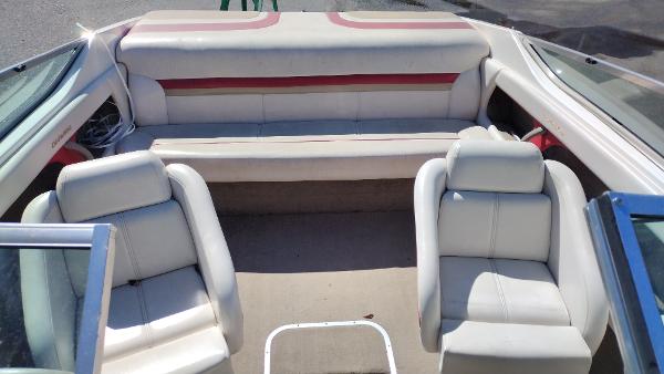 1999 Chaparral 2130 SS boat interior with white and red seating arrangement.