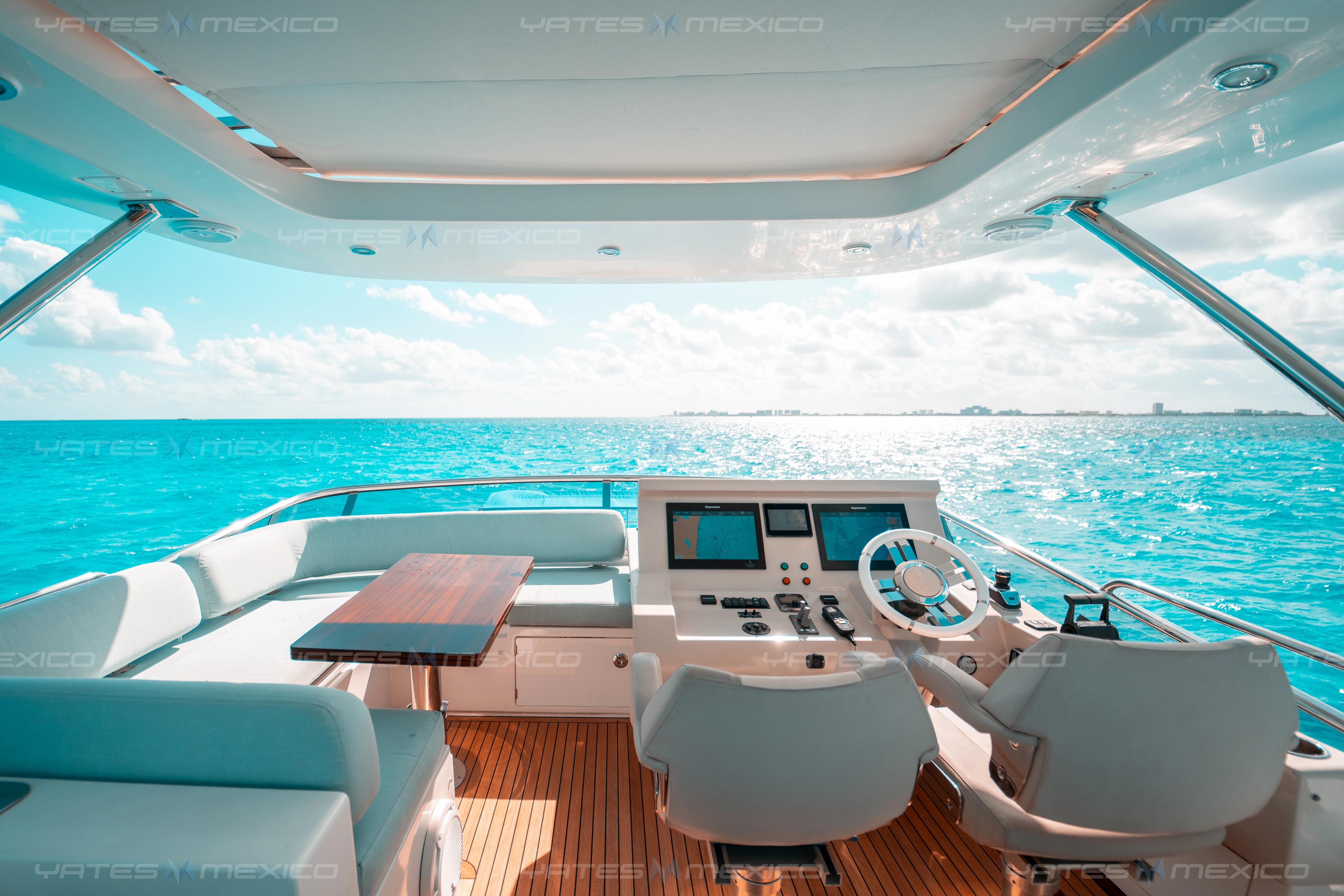 Luxurious 2017 Azimut 66 yacht interior with ocean view and modern helm.