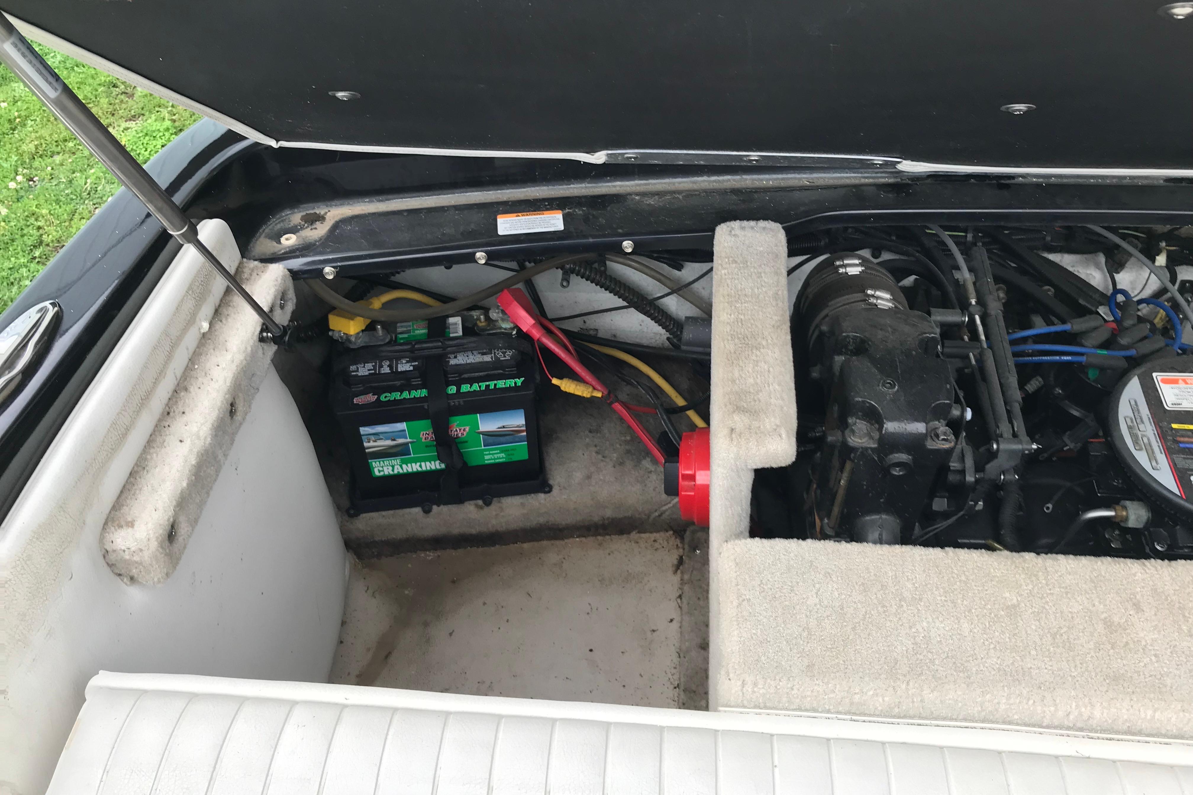 2015 Crownline 18 SS boat engine compartment with battery and wiring.
