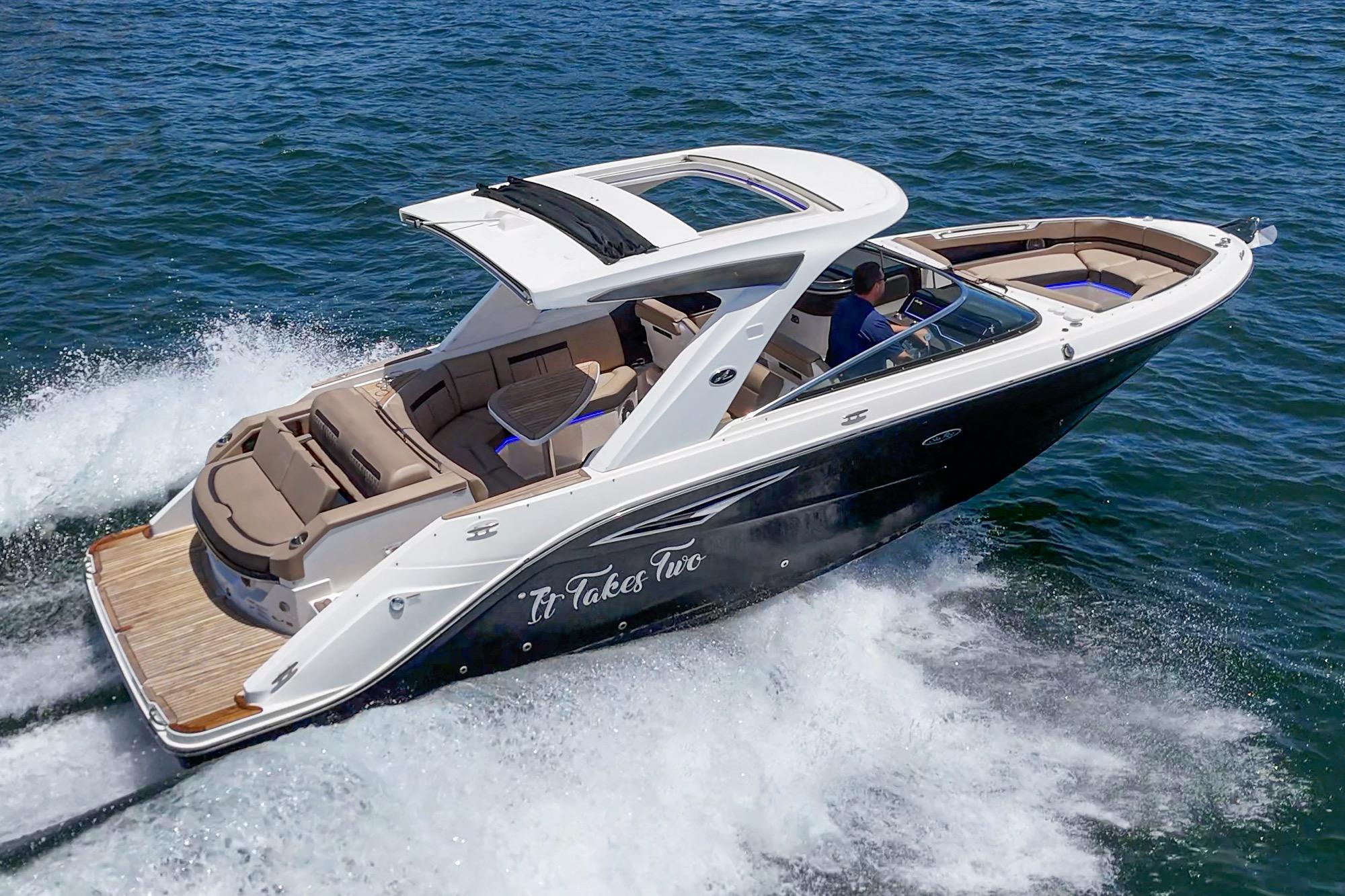2018 Sea Ray SLX 310 cruising on open water, showcasing sleek design and luxury features.