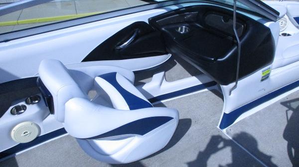 Interior of 2012 Crownline 21 SS boat with white and blue seating.