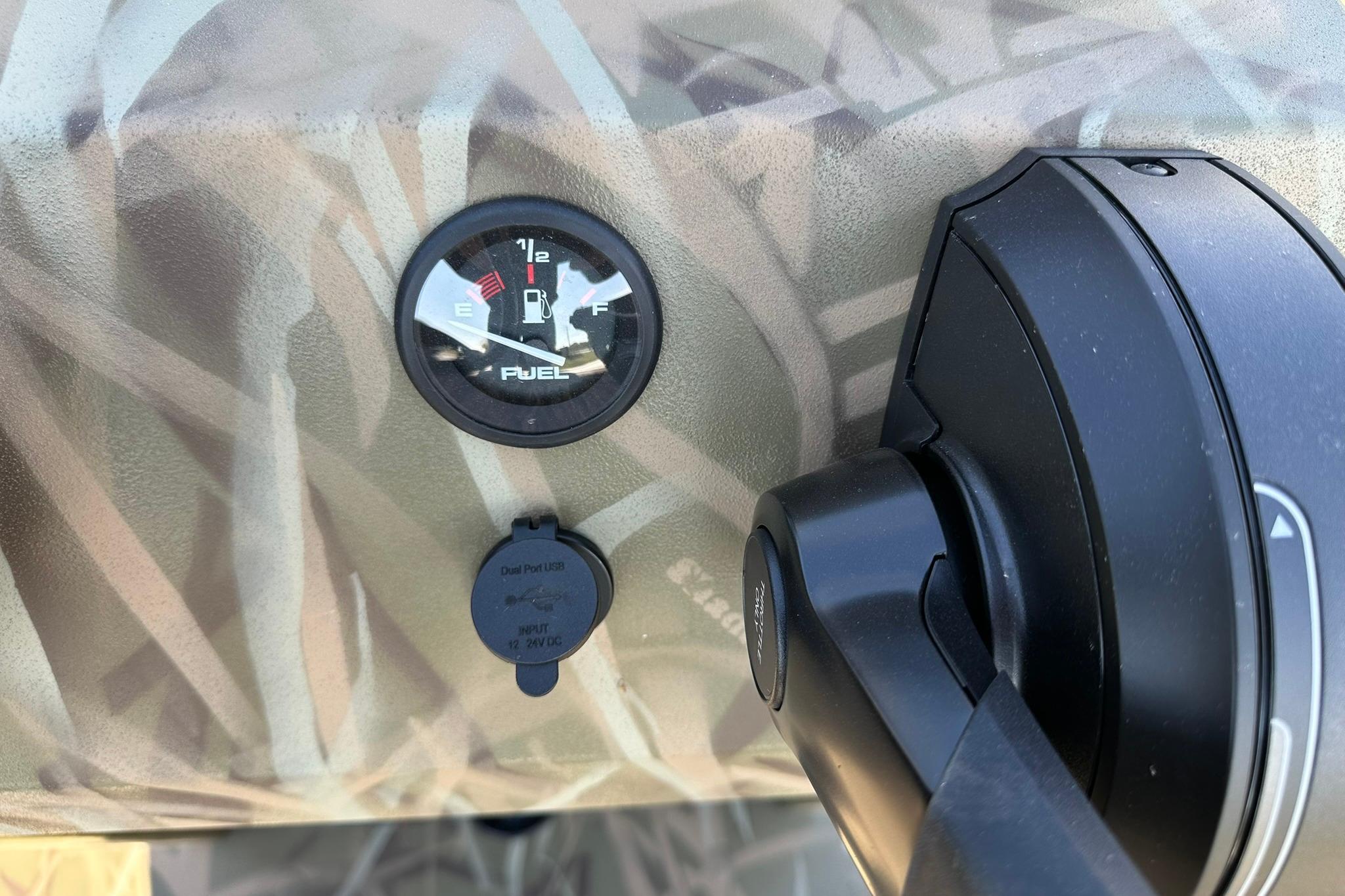 Fuel gauge and control panel on 2026 Lowe Roughneck 2070CC boat.