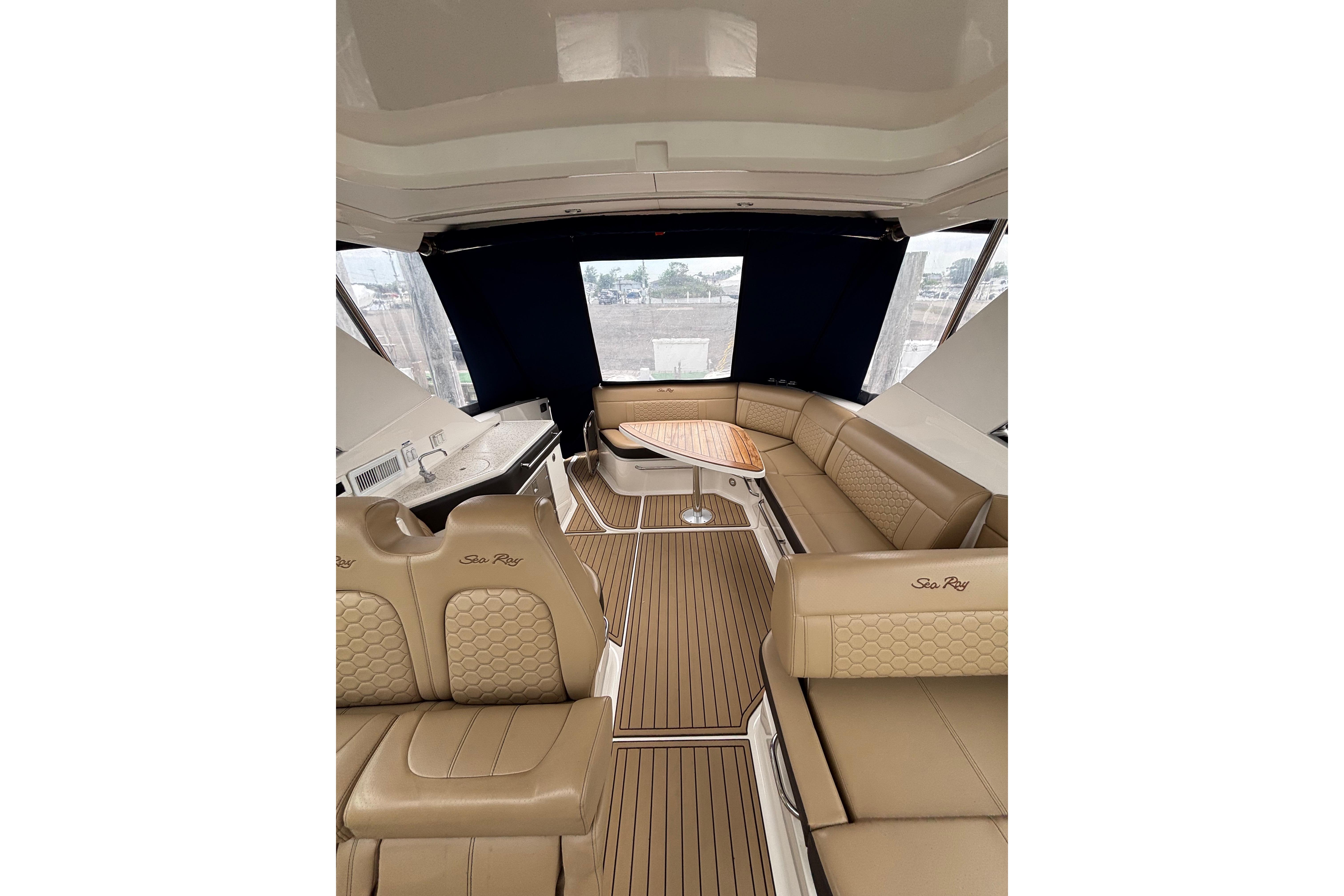 Interior of 2021 Sea Ray Sundancer 320 Outboard with luxurious seating and elegant design.