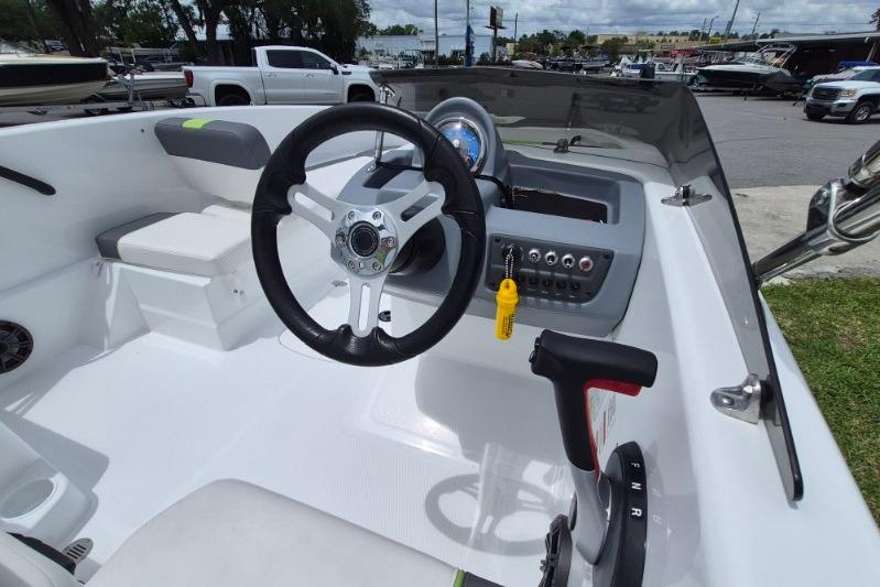 Steering console of a 2021 Tahoe T16 boat, featuring modern controls and dashboard.