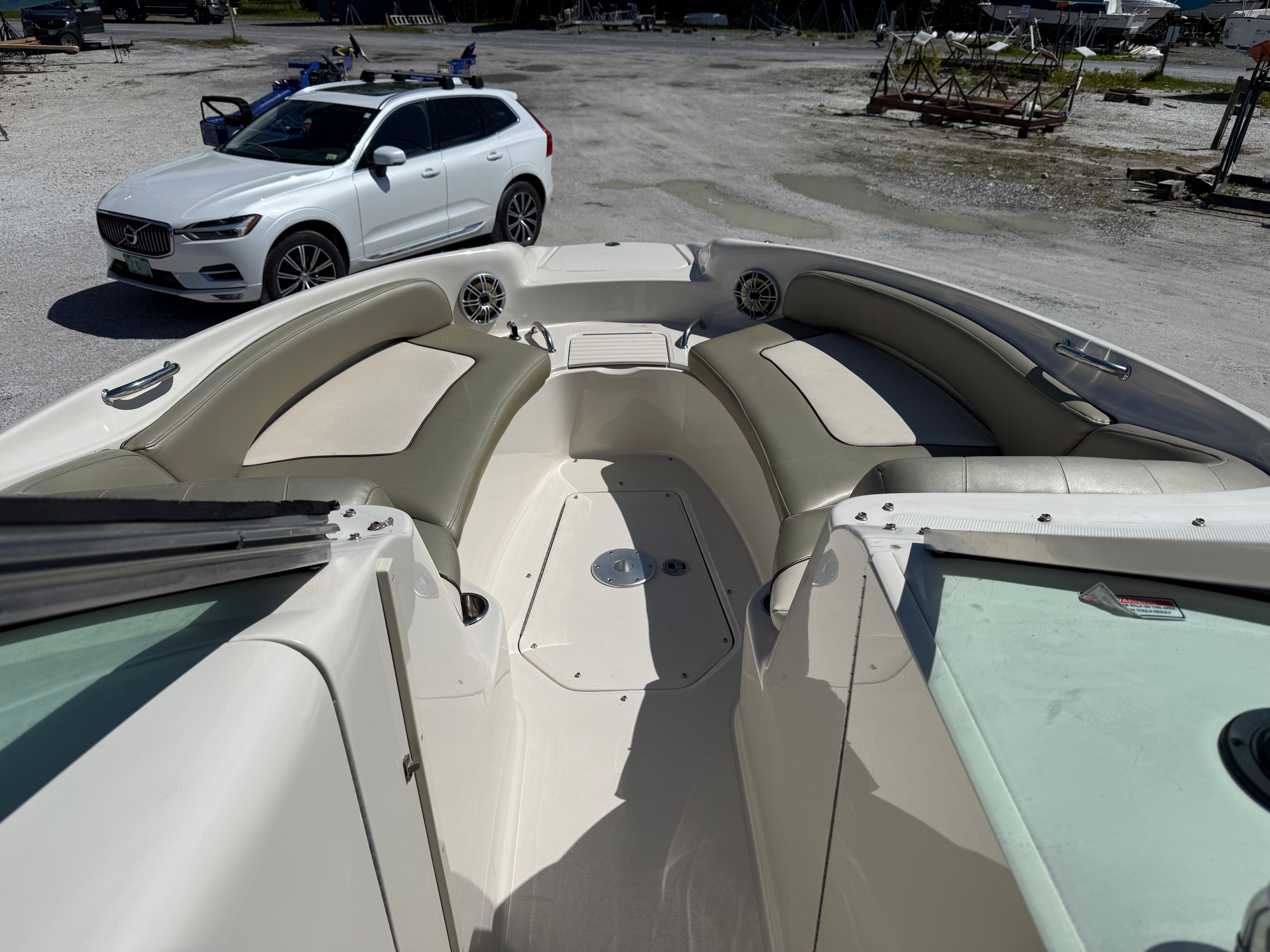 Interior view of a 2005 Sea Ray 240 Sundeck boat on a parking lot.