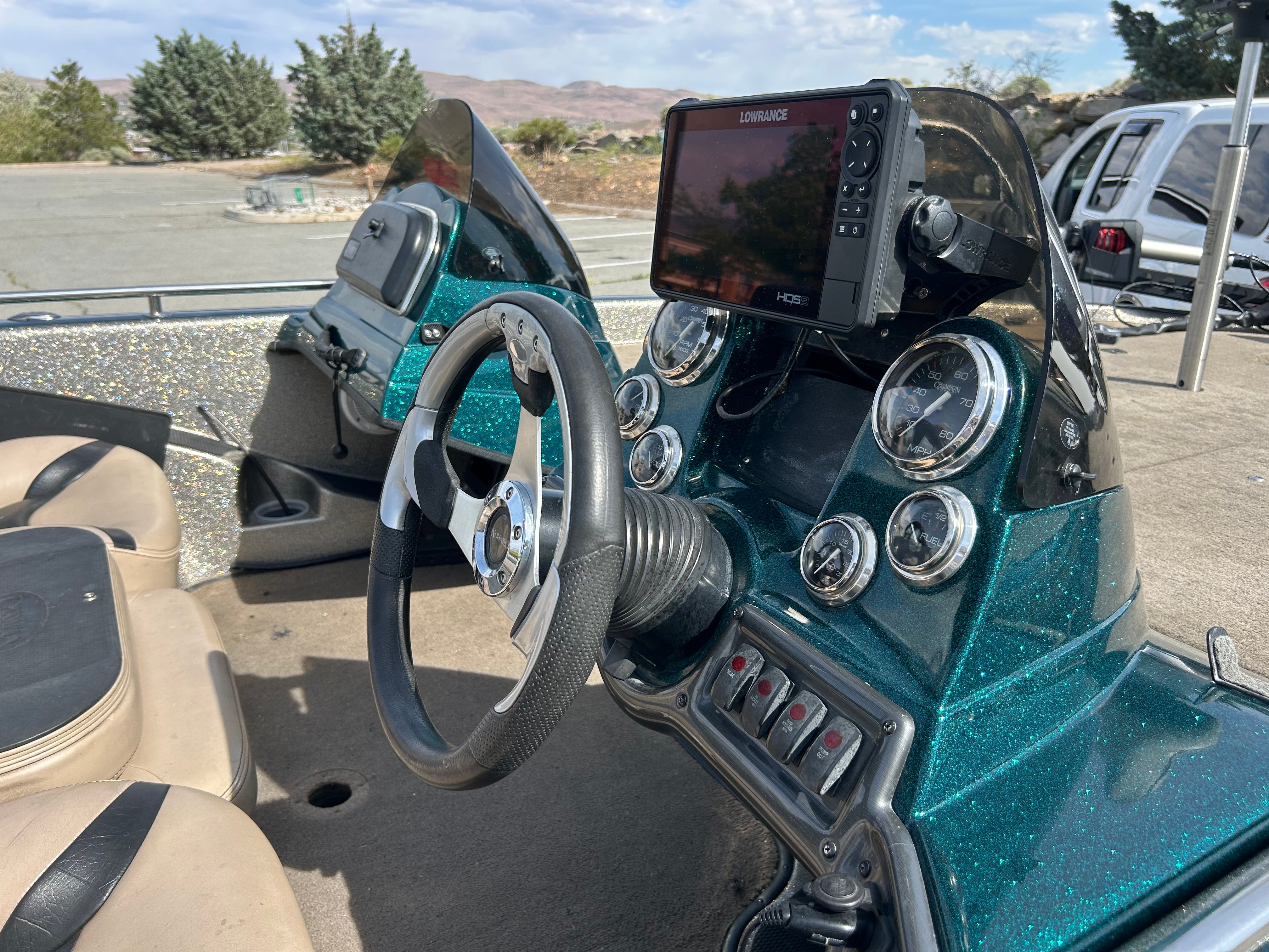 Interior view of a 2008 Champion 183 boat with steering and instruments.