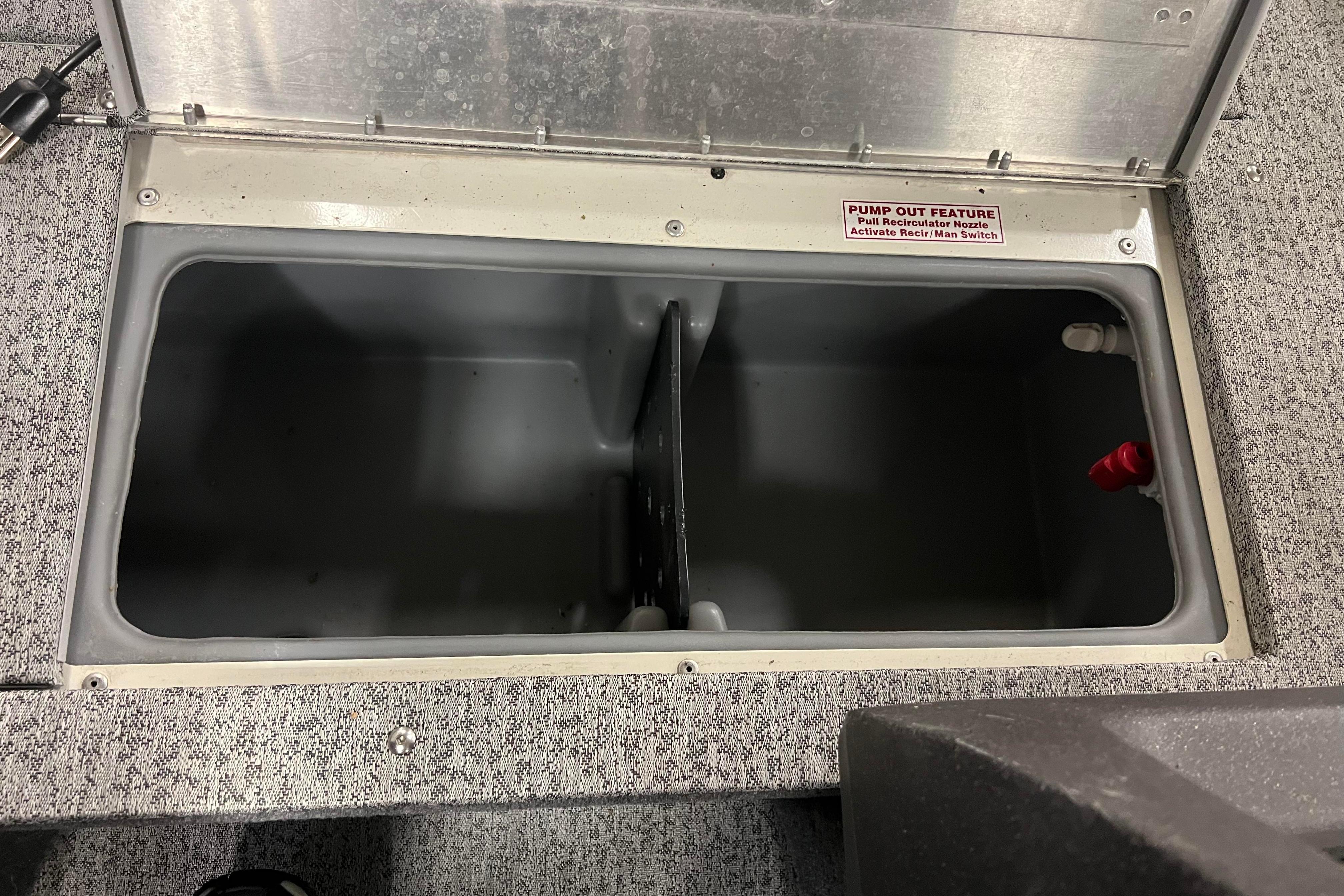 2022 Tracker Pro Guide V-16 WT boat storage compartment with pump-out feature.