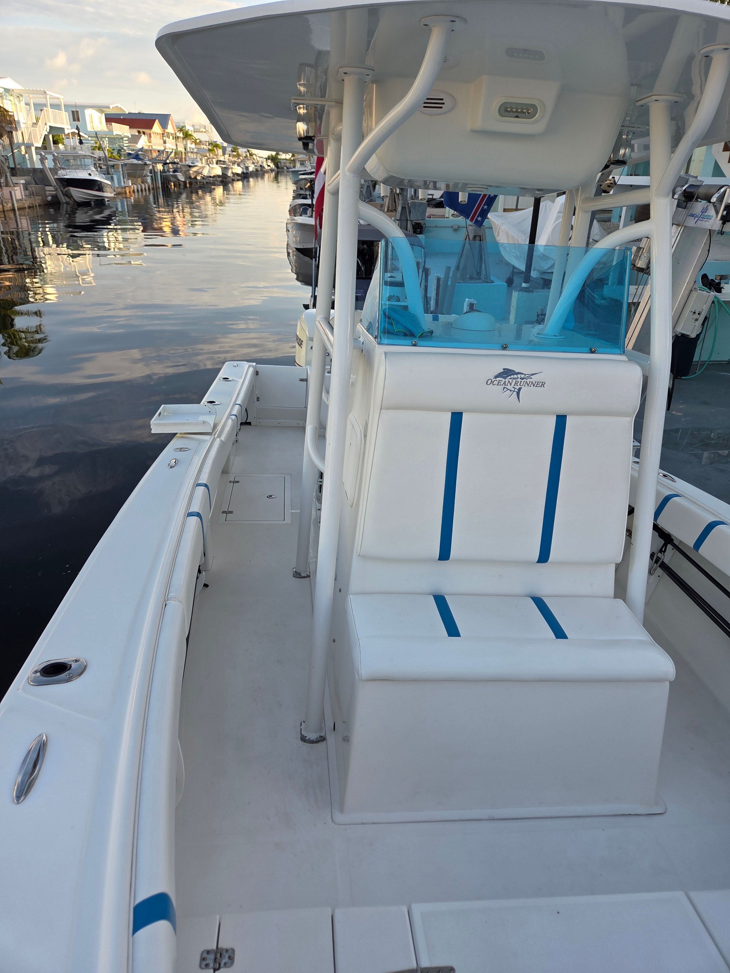 Ocean Runner 29 boat on calm water canal, year 2012.