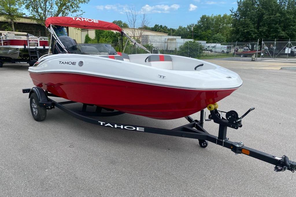 2026 Tahoe T16 boat with red hull on trailer, parked outdoors.