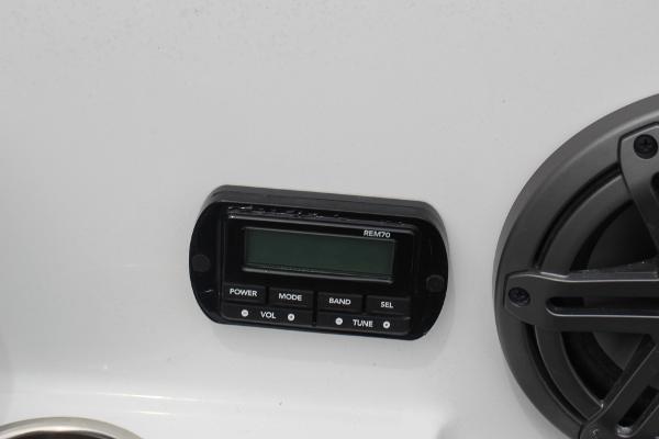 Control panel and speaker on 2023 Scarab 255 Open ID boat.