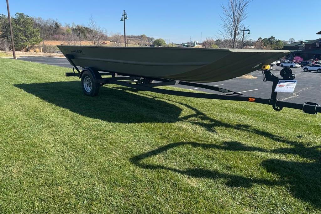 2026 Tracker Grizzly 1754 Utility boat on trailer, parked on grass under clear sky.