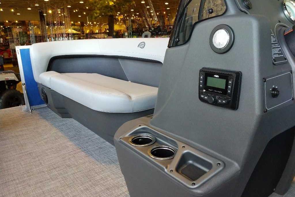 2026 Sun Tracker Party Barge 16 DLX interior with seating and control panel.
