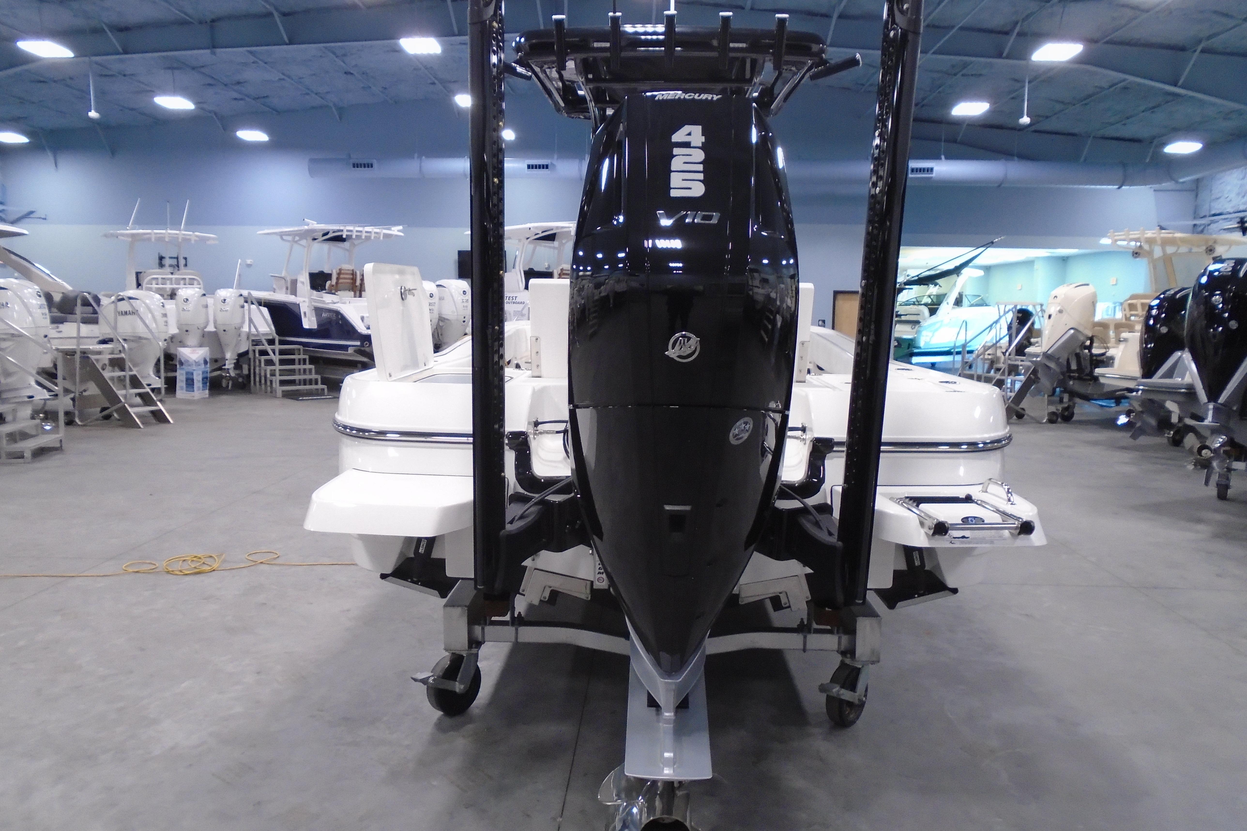 2026 Caymas 26 HB boat with Mercury 425 V10 engine in showroom.