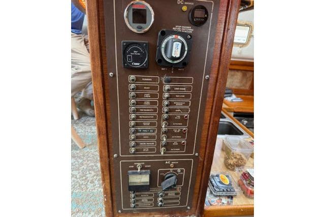 Electrical control panel on a 1982 Lancer 45 Motorsailer, featuring switches and gauges.