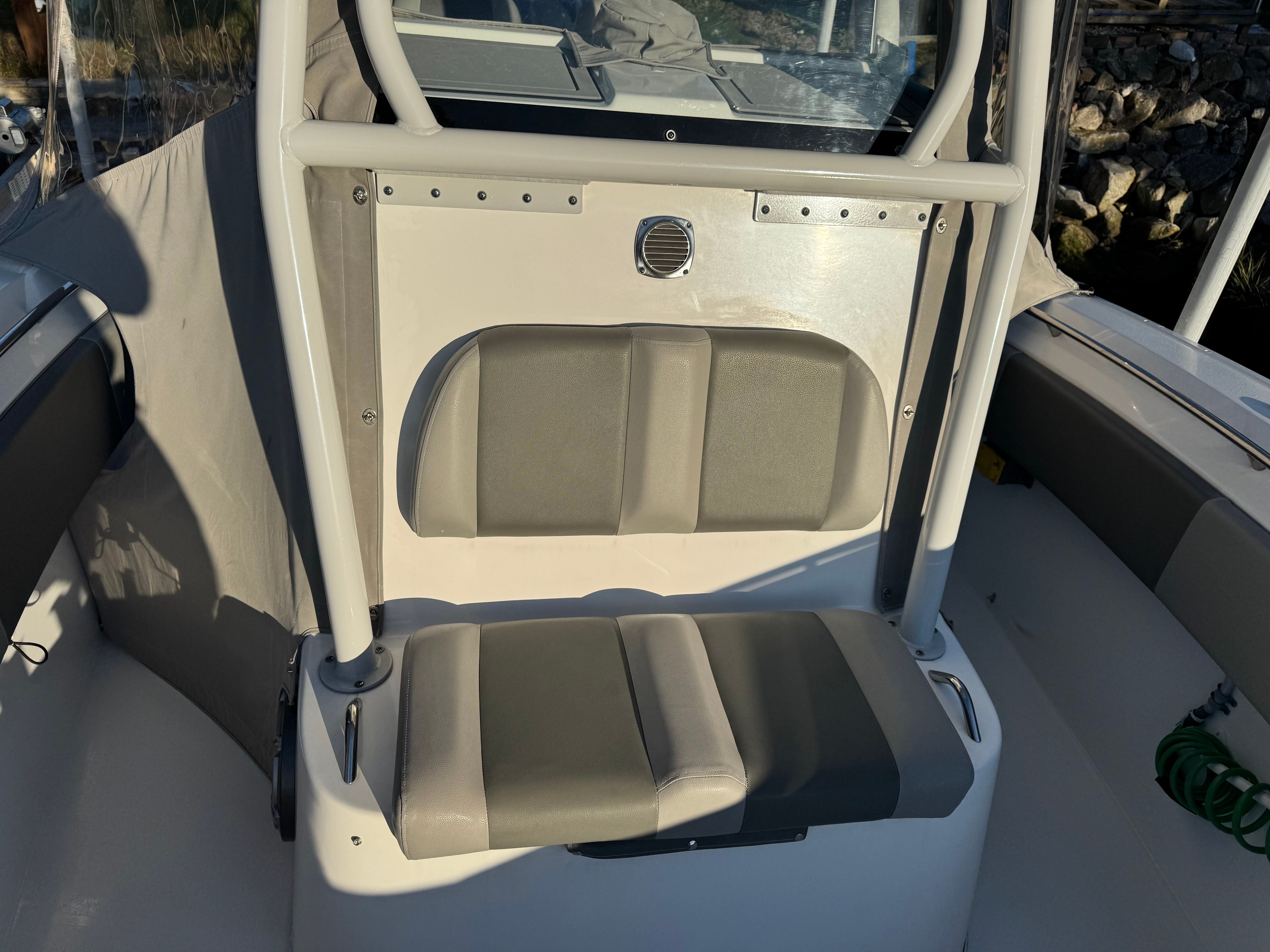 Interior of a 2021 Cape Horn 32 XS boat, gray upholstery.