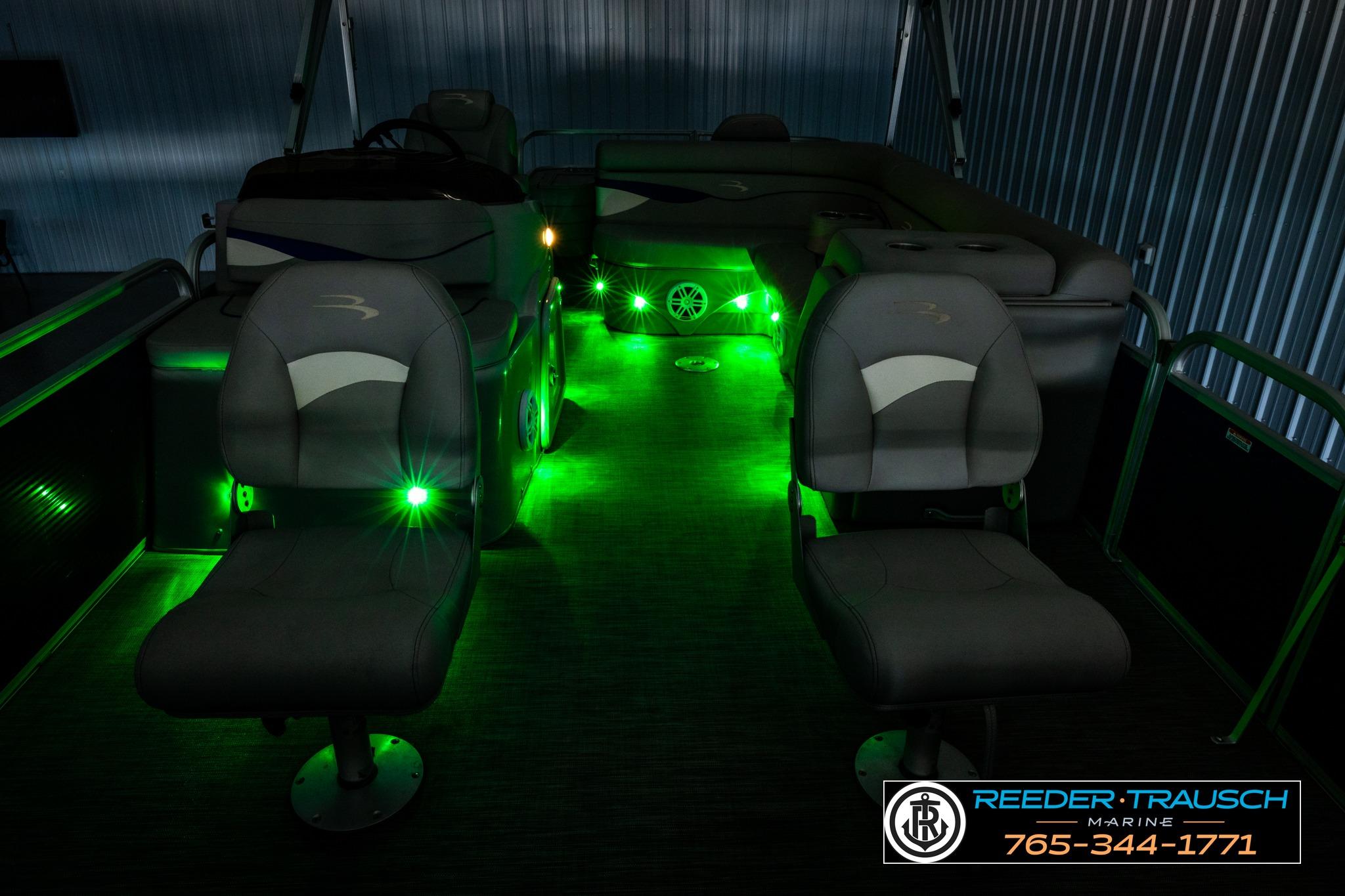 2021 Bennington 20 SV pontoon boat interior with green LED lighting.