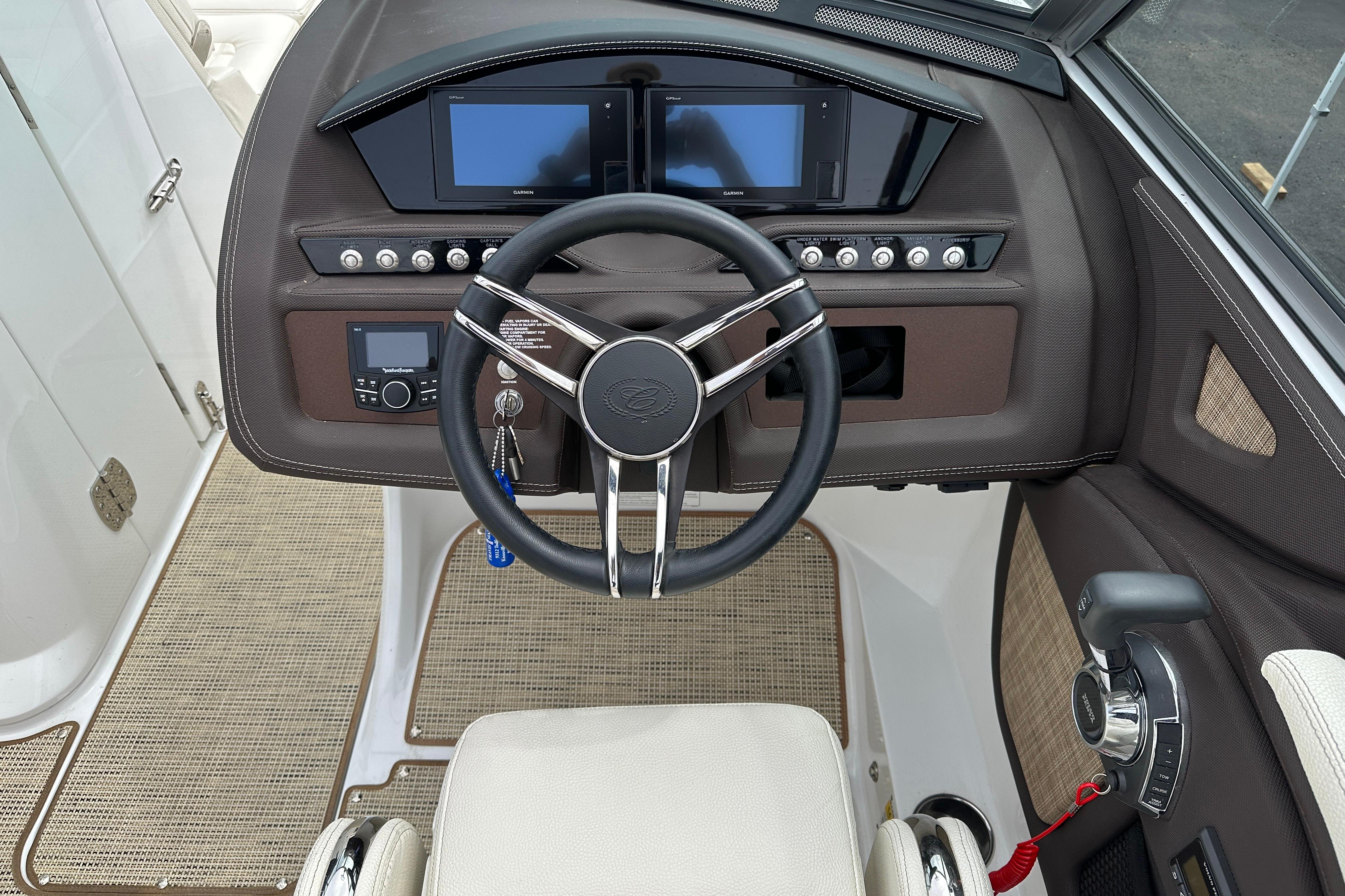 2019 Cobalt R5 boat dashboard with steering wheel and control panel.