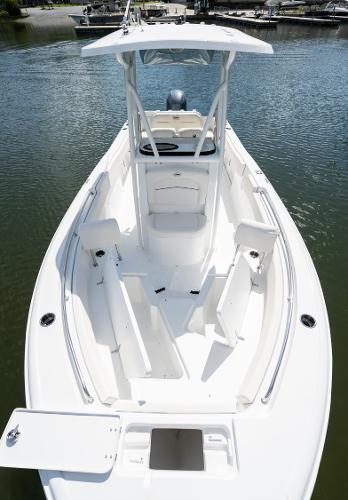 2024 Sea Hunt Ultra 234 boat on water, showcasing spacious deck and seating.