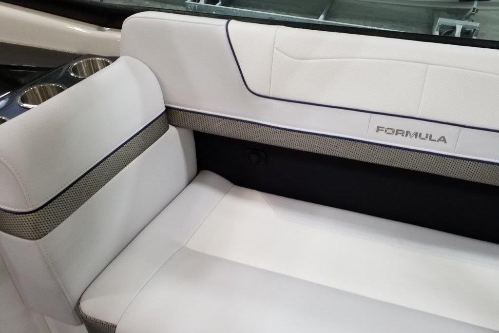2021 Formula 350 Sun Sport boat interior with white seating and cup holders.