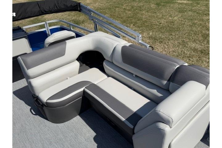 2026 Sun Tracker Fishin' Barge 20 DLX pontoon boat with comfortable seating.
