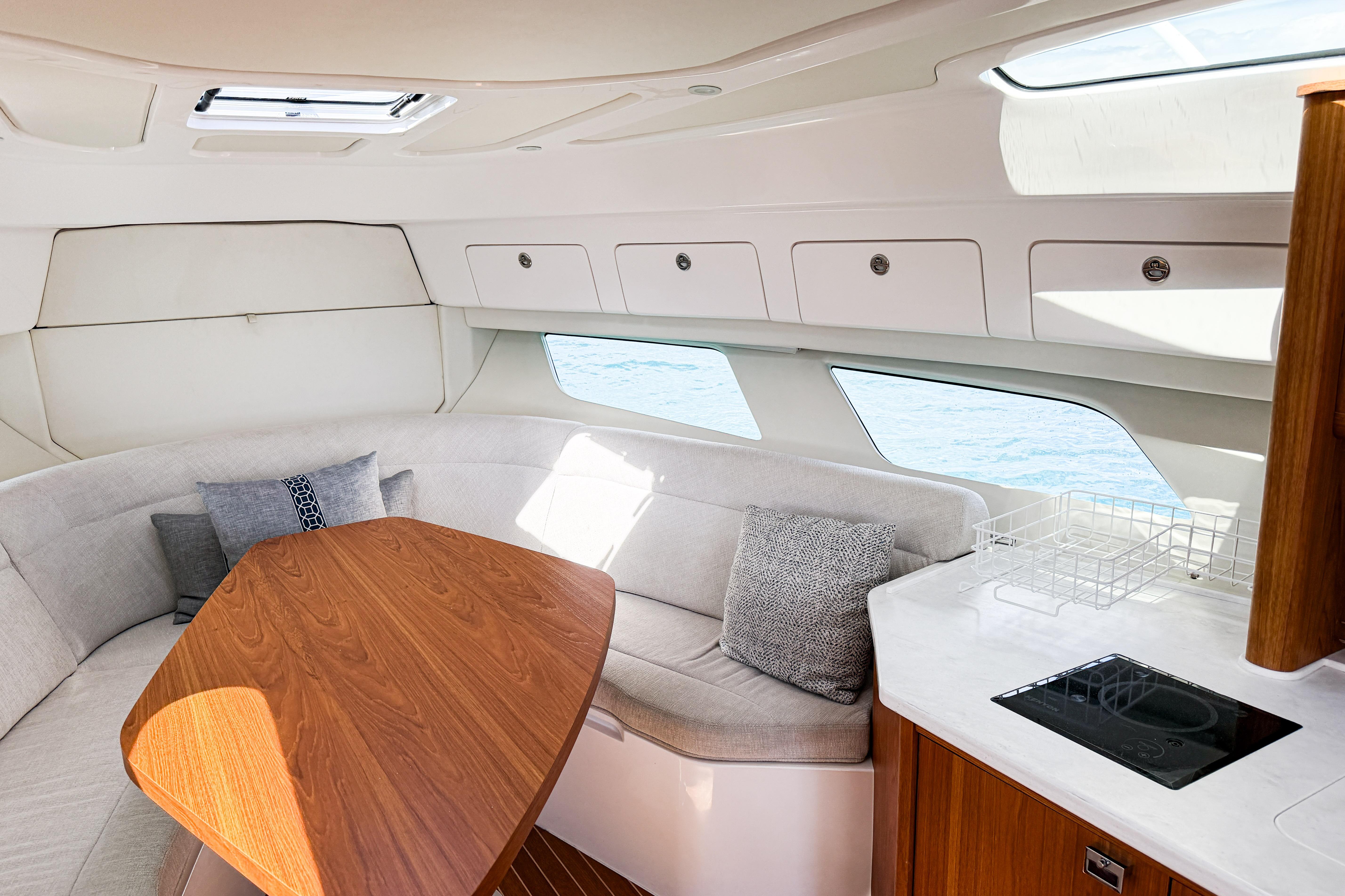 Luxurious interior of 2018 Intrepid 438 Evolution yacht with elegant seating and modern amenities.