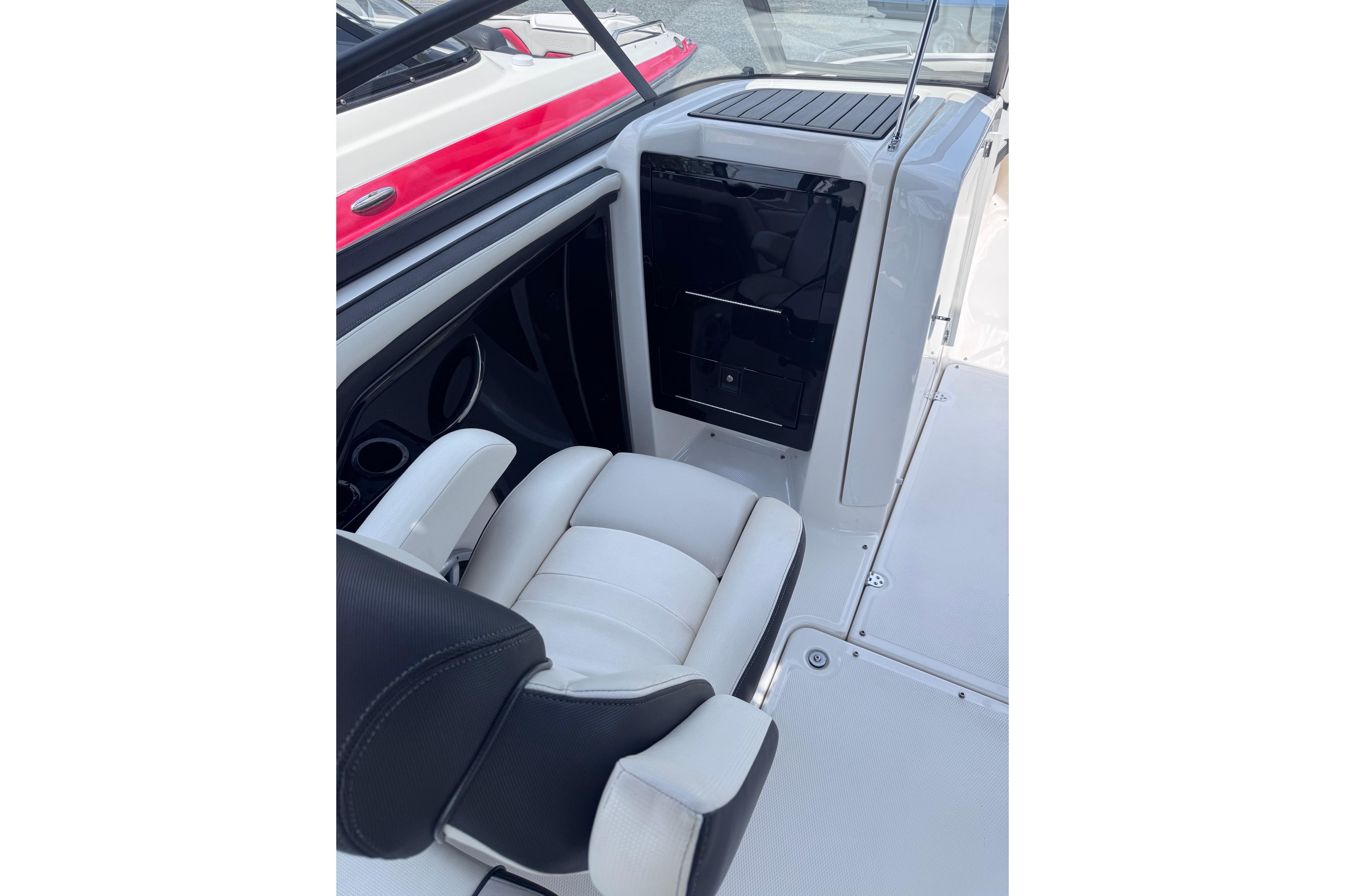 2019 Yamaha Boats 242SE interior with white seating and sleek black accents.