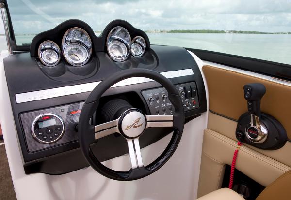 Manufacturer Provided Image: 2014 Sea Ray 260 Sundeck helm with steering wheel and control panel.