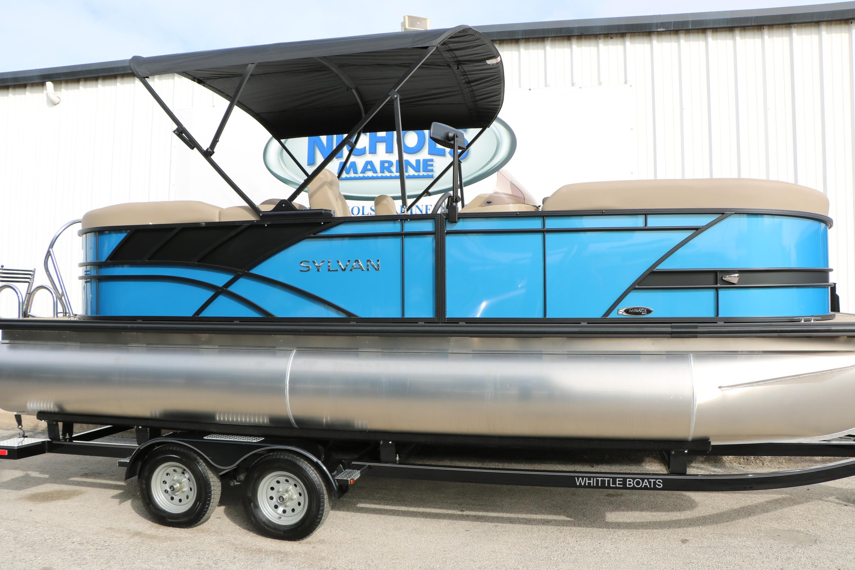 2026 Sylvan Mirage 822 LZ pontoon boat with blue exterior and black canopy.