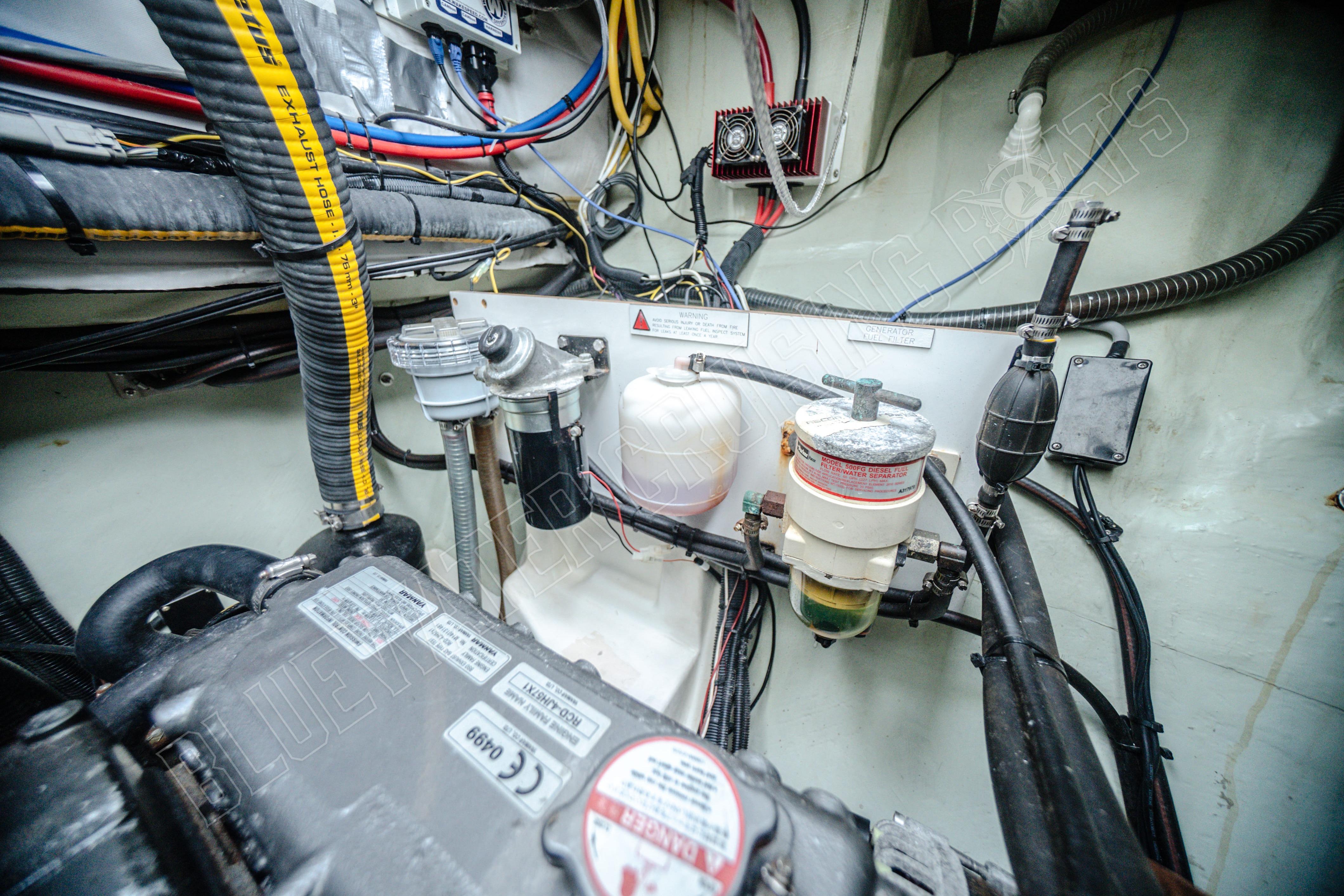 Engine room of a 2015 Leopard 48 yacht with visible wiring and components.