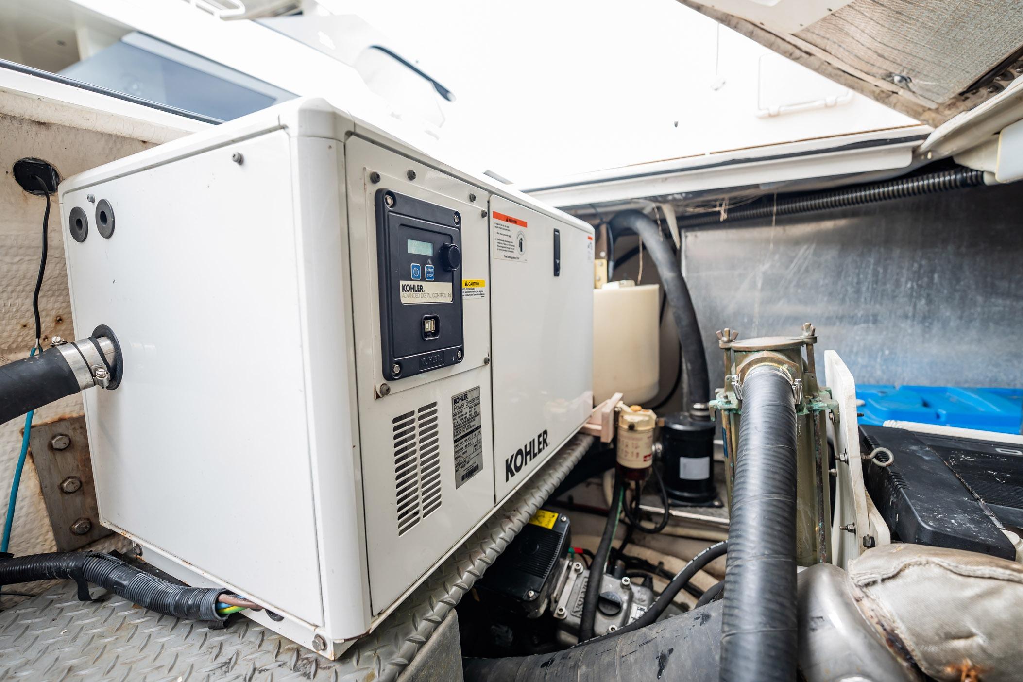 Engine room of 2008 Regal Commodore 4460 with Kohler generator.