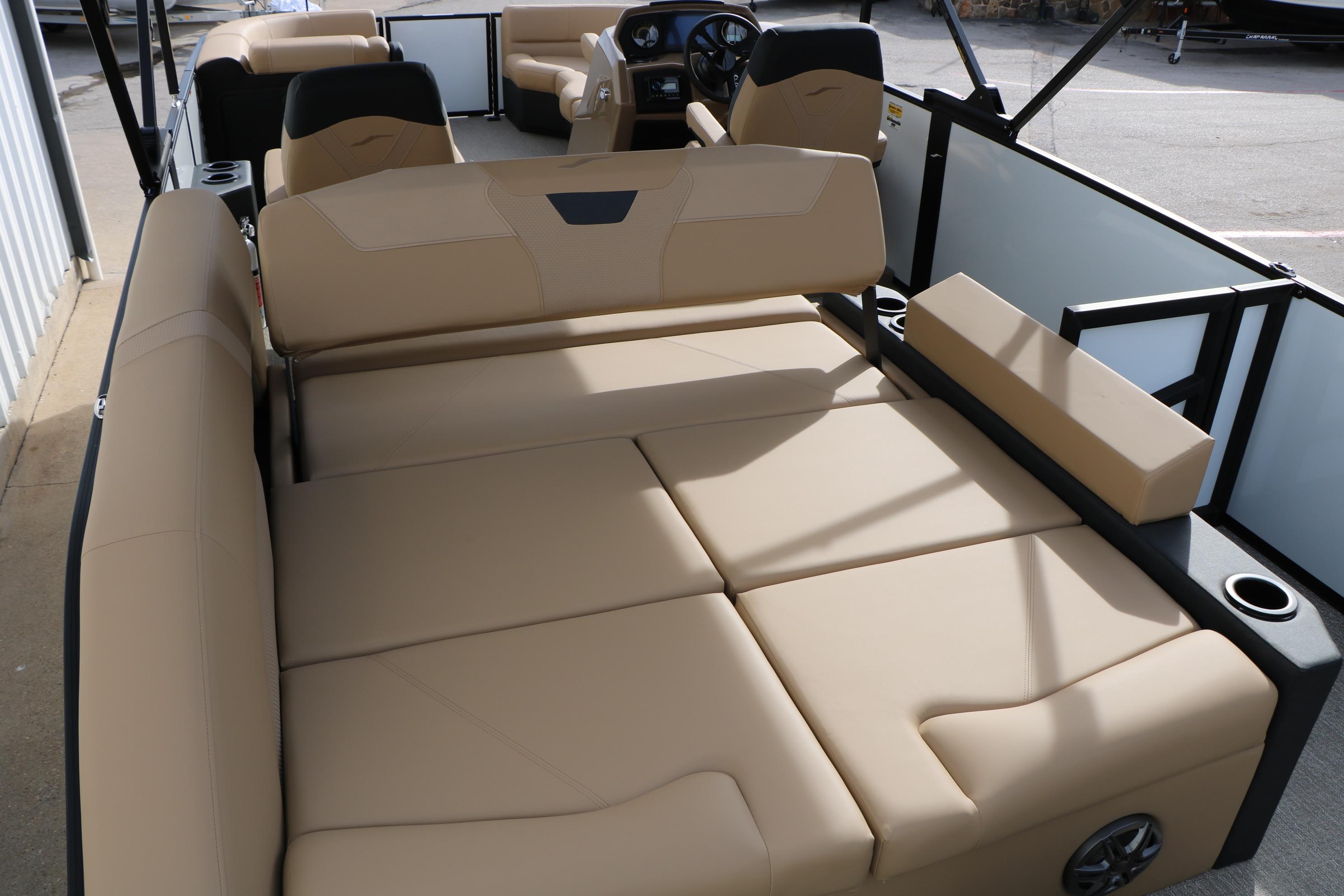 Luxurious seating on 2026 Evotti 523CS boat, featuring beige upholstery and modern design.