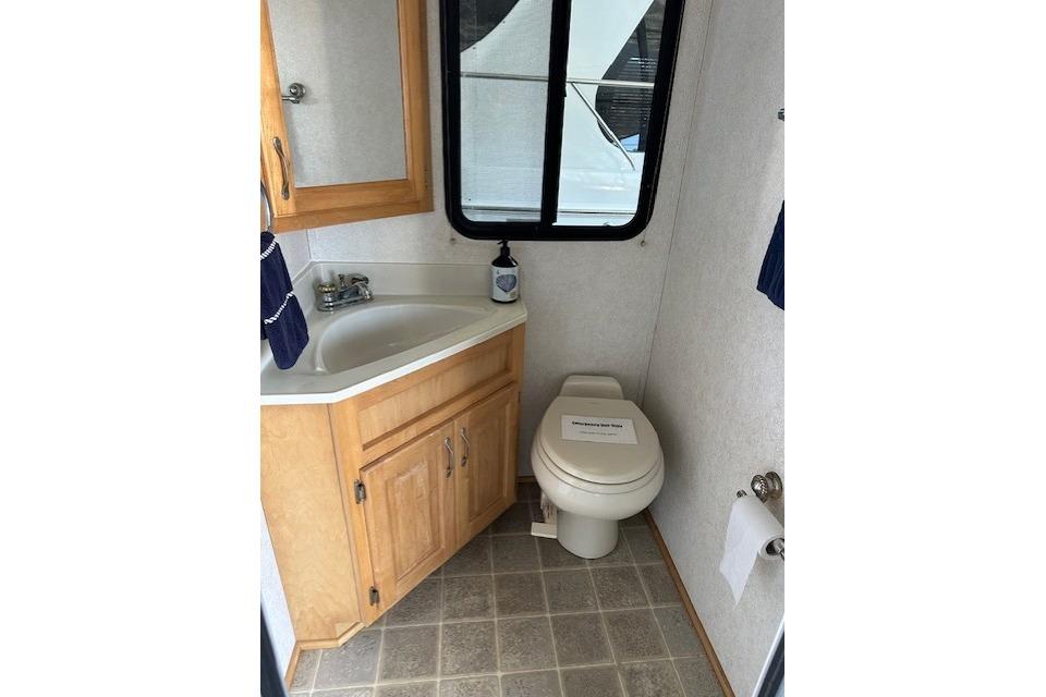 Bathroom interior of 2008 Destination Yachts 45X14 with sink and toilet.