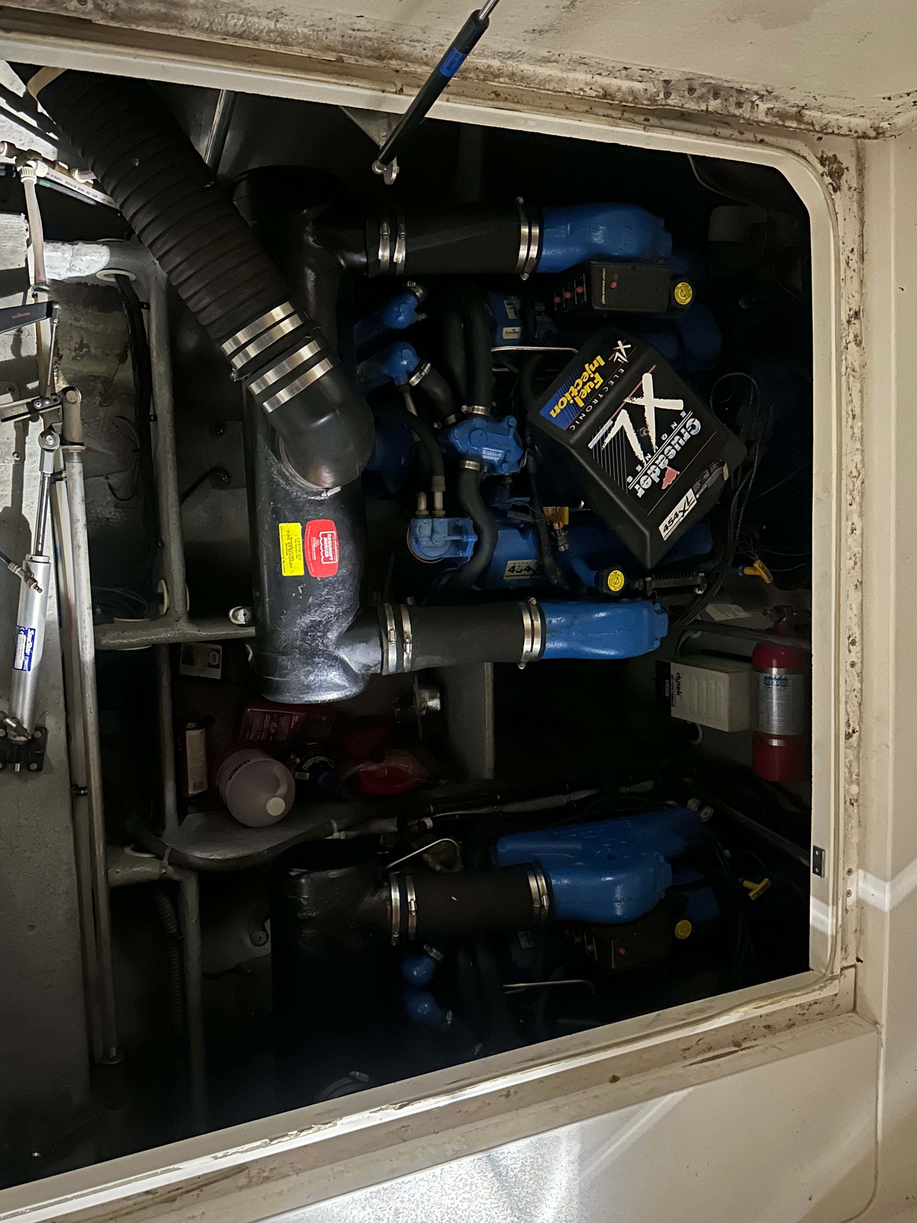 Engine room of a 1998 Silverton 351 Sedan with blue components.