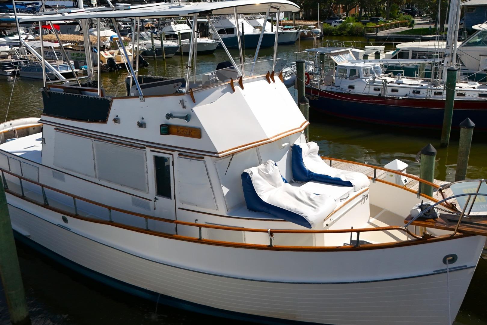 1978 Grand Banks 42 Classic yacht docked in a marina, featuring elegant wooden details.