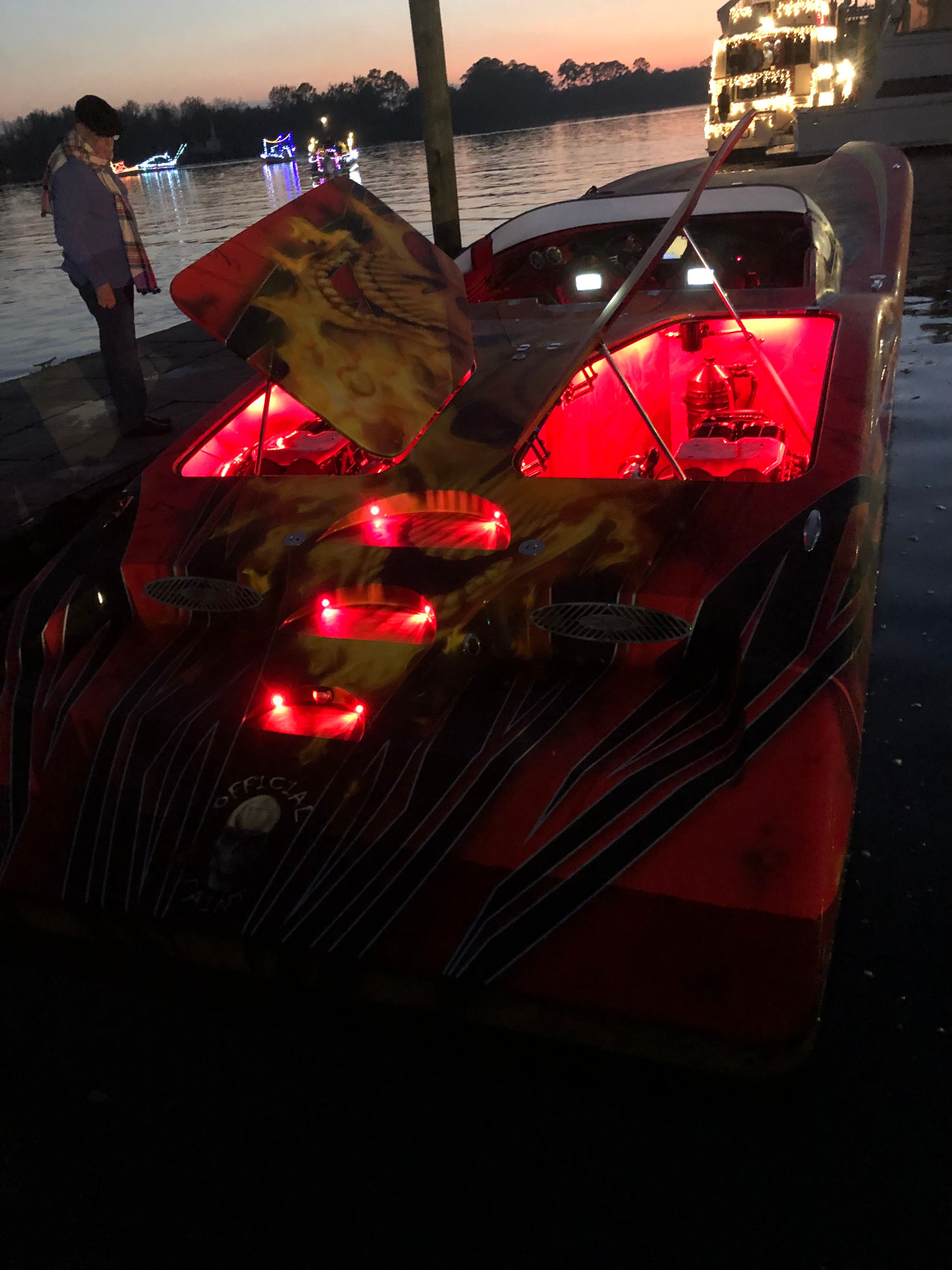 A 2010 MTI CAT with striking lighting is docked at sunset.