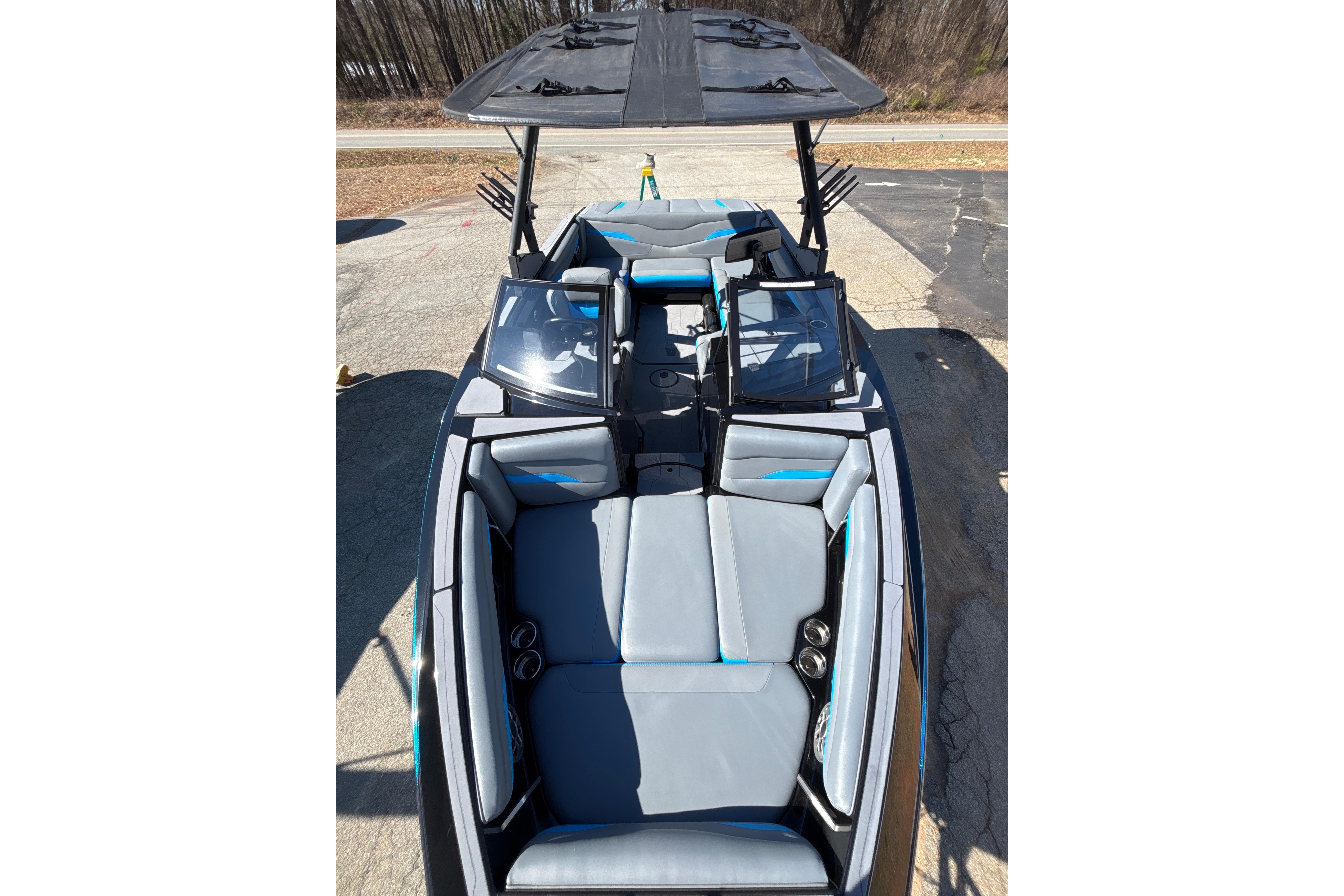 2023 Axis T220 boat interior with gray seating and open windshield.