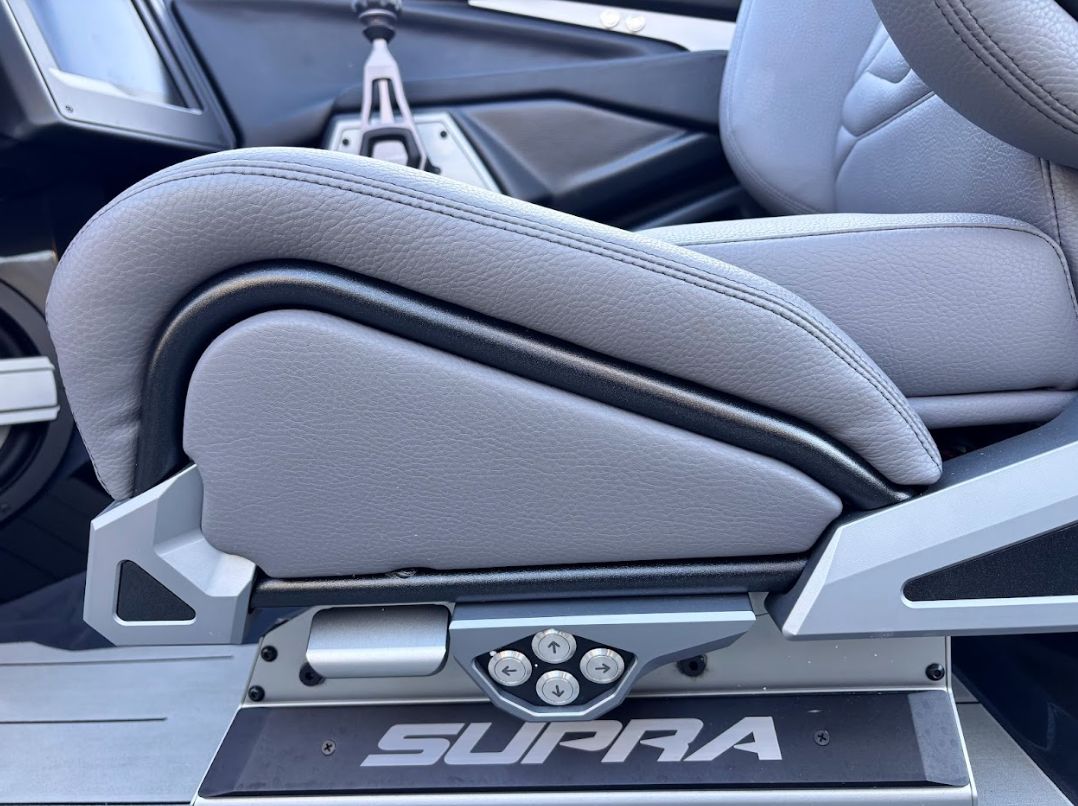 Interior of 2025 Supra SA 450 with gray leather seat.