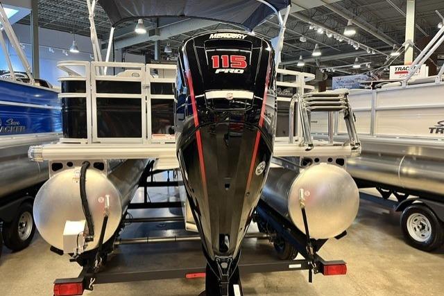 2026 Sun Tracker SportFish 20 DLX pontoon boat with Mercury 115 Pro motor in showroom.